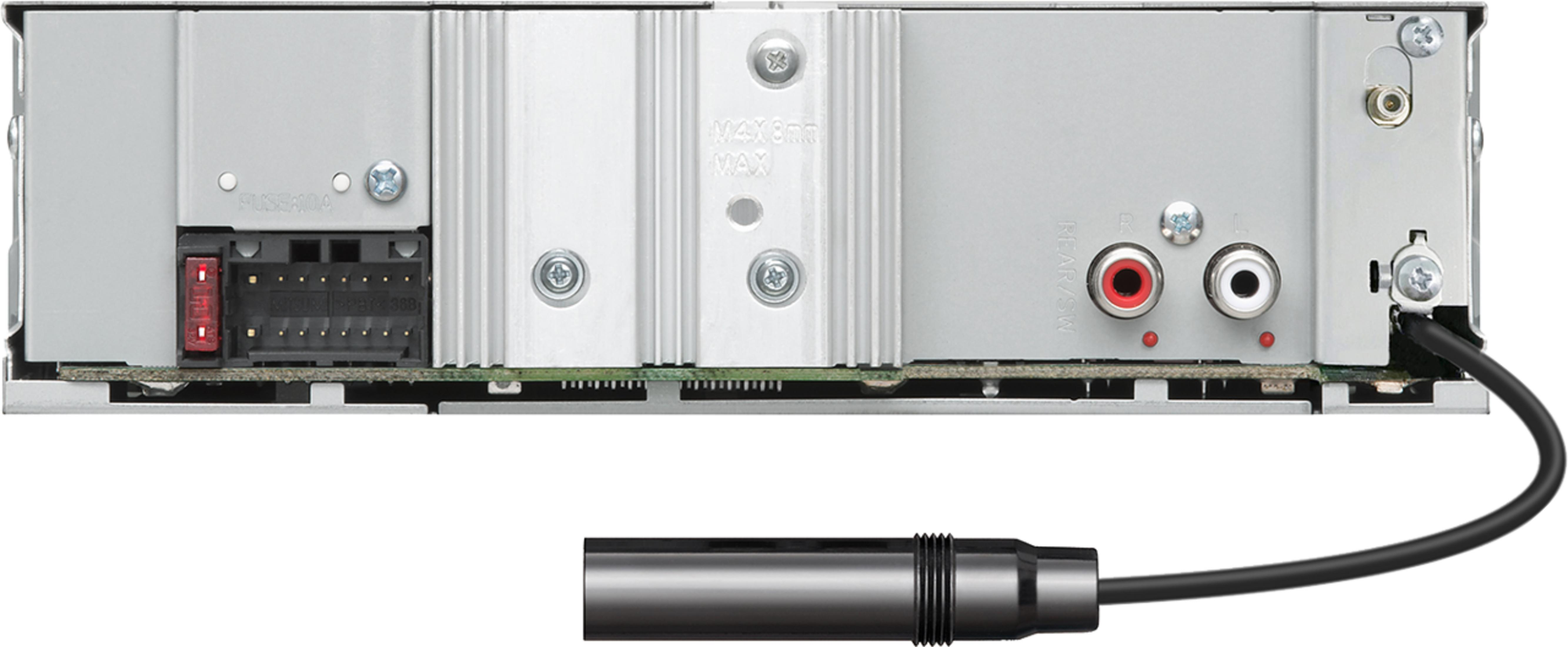 Back of a car stereo with ports, fuse, and cable.