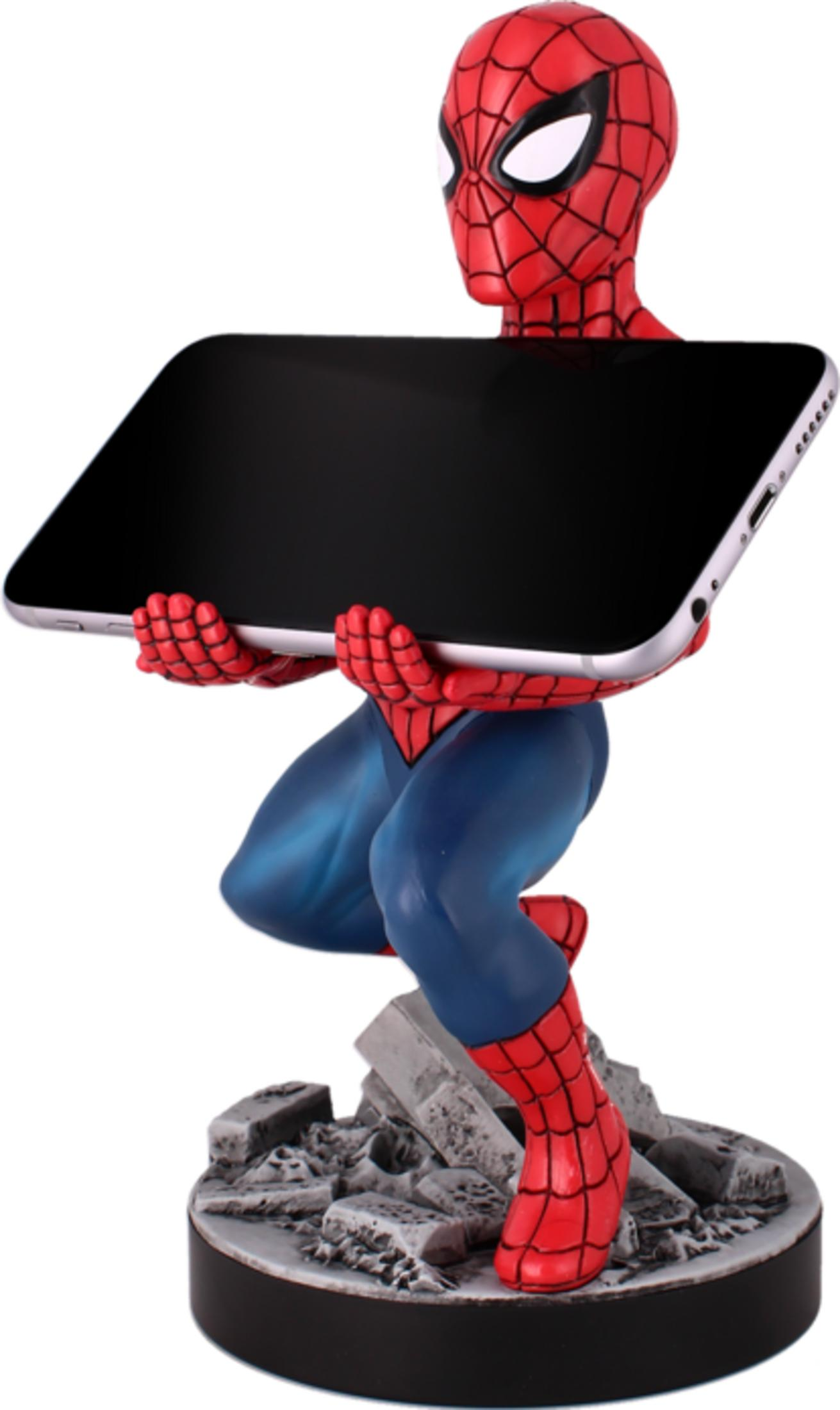 Statua di Spiderman che tiene un tablet nero su macerie.