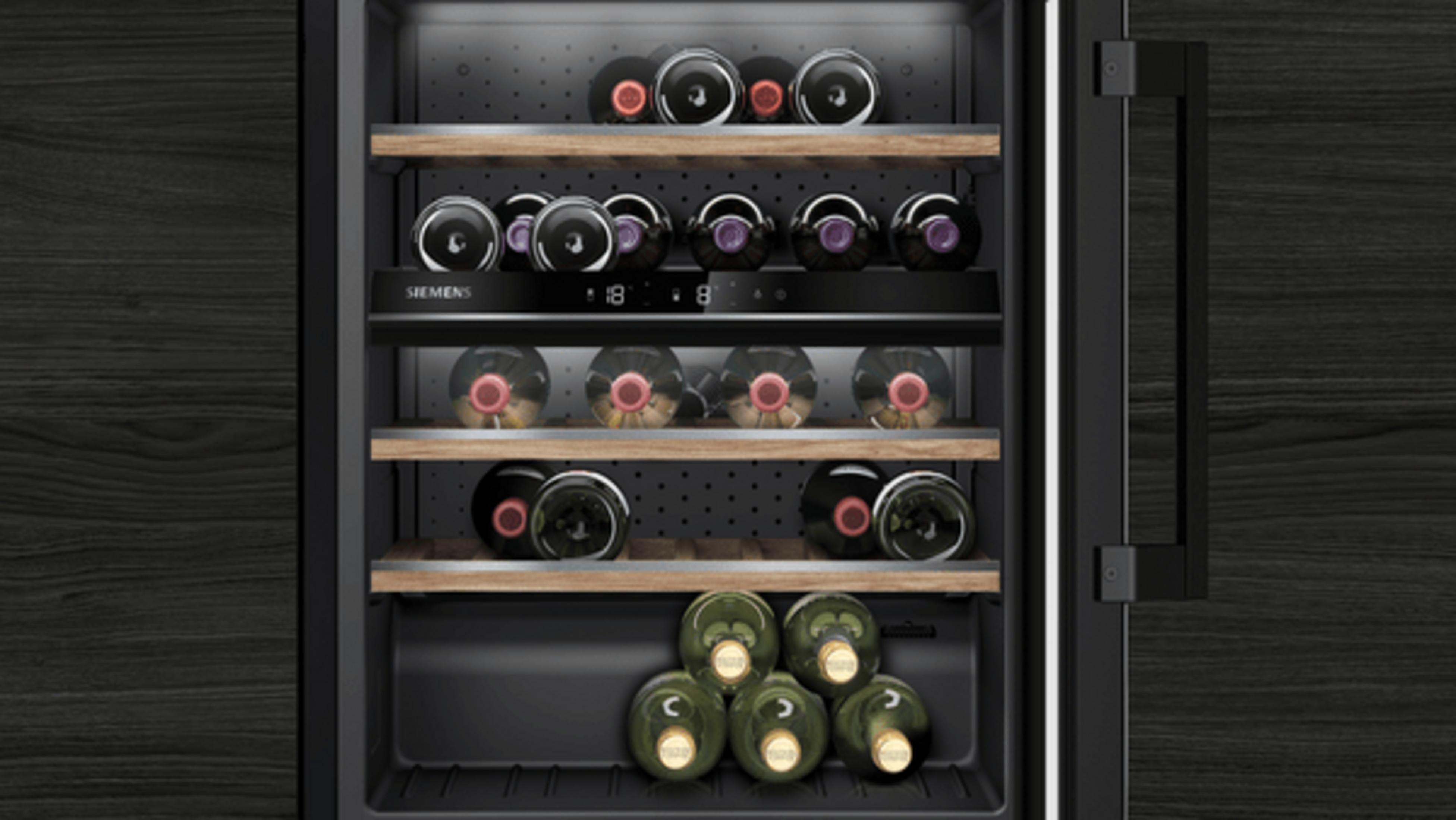 A wine fridge with wooden shelves holding multiple rows of wine bottles.