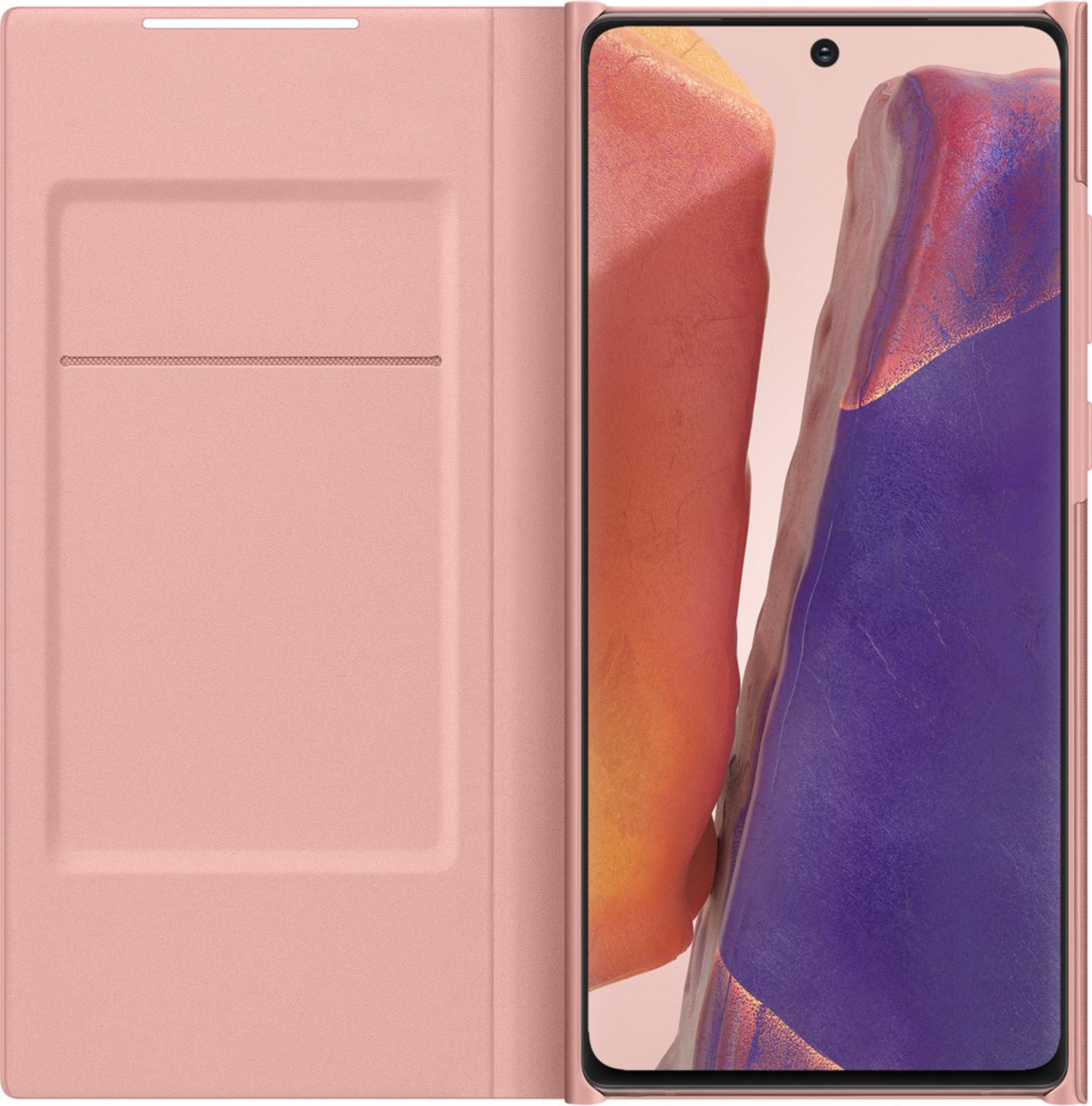 Una custodia rosa per telefono accanto a uno smartphone con sfondo viola e arancione.
