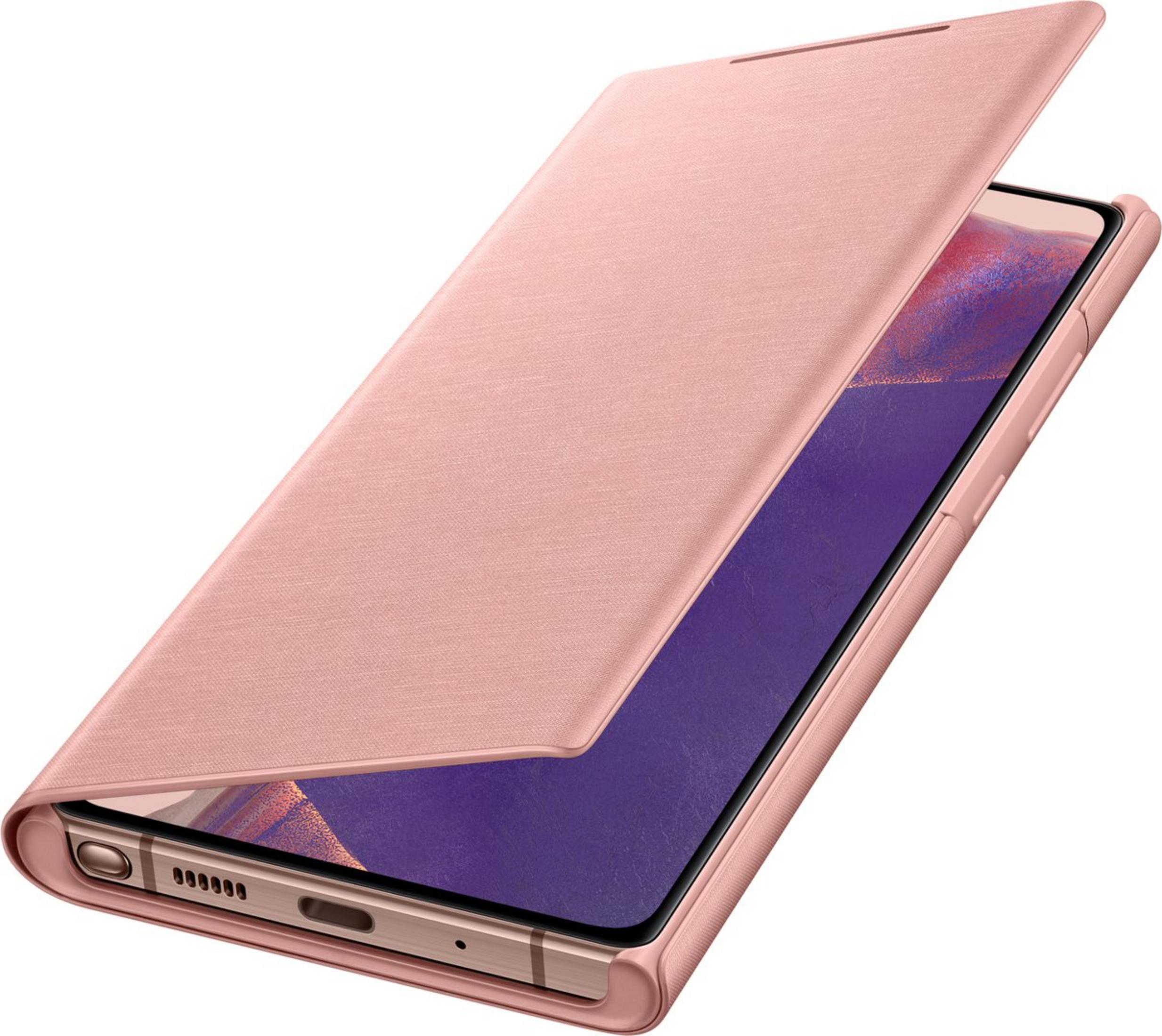 Uno smartphone oro rosa con cover aperta giace su sfondo bianco.