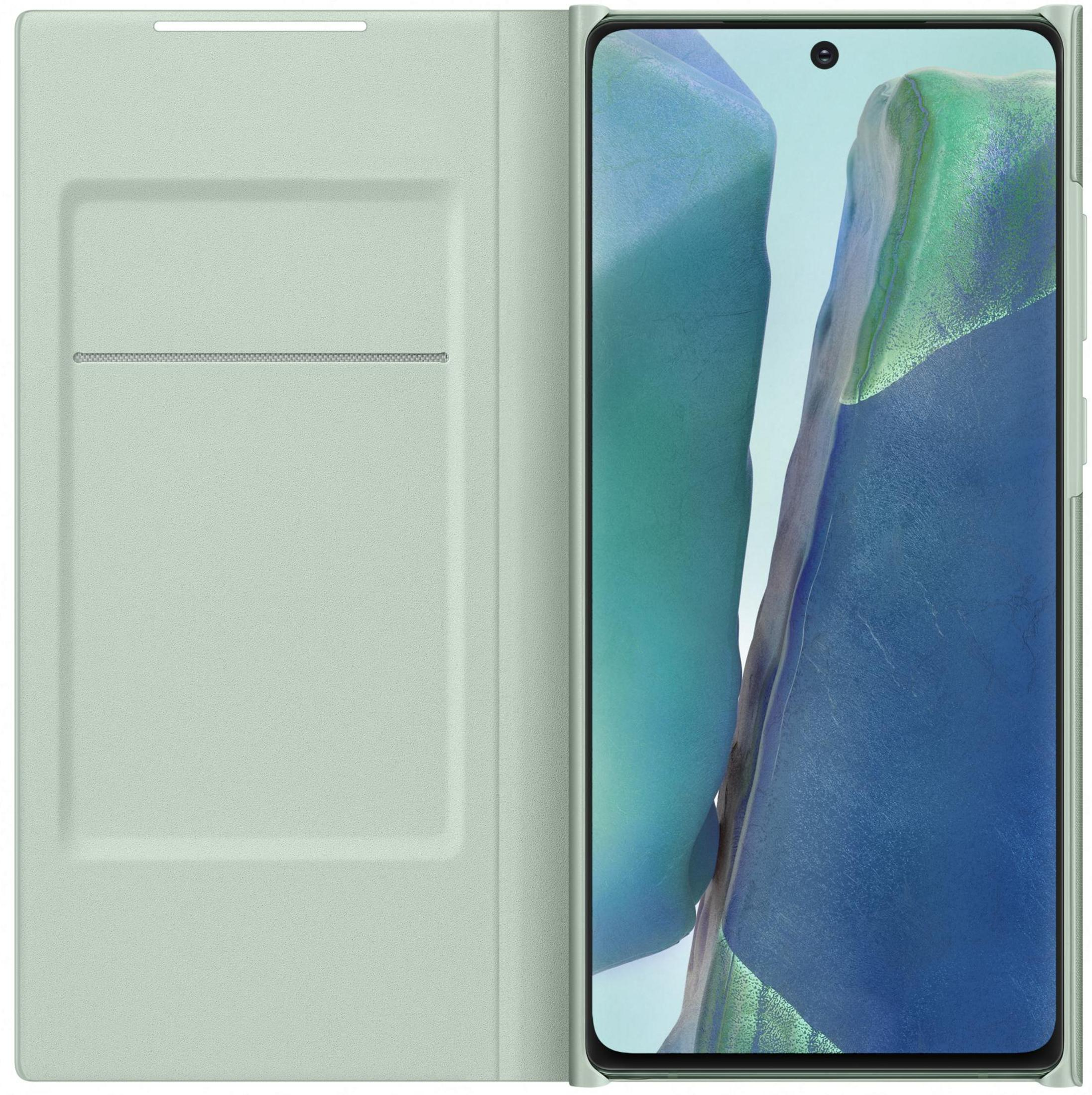 Una funda de libro verde claro está al lado de un smartphone con fondo azul.