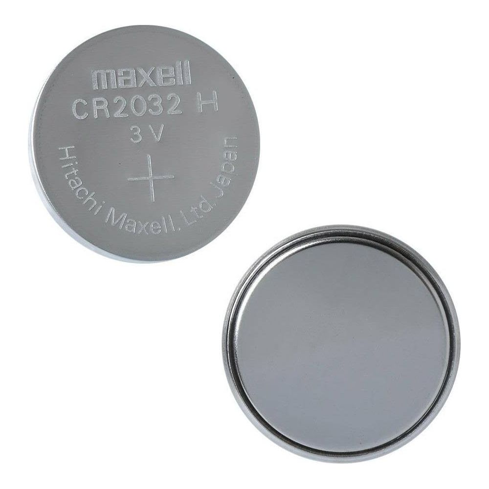 Dos pilas de botón plateadas, una con la etiqueta 'Maxell CR2032 3V'.