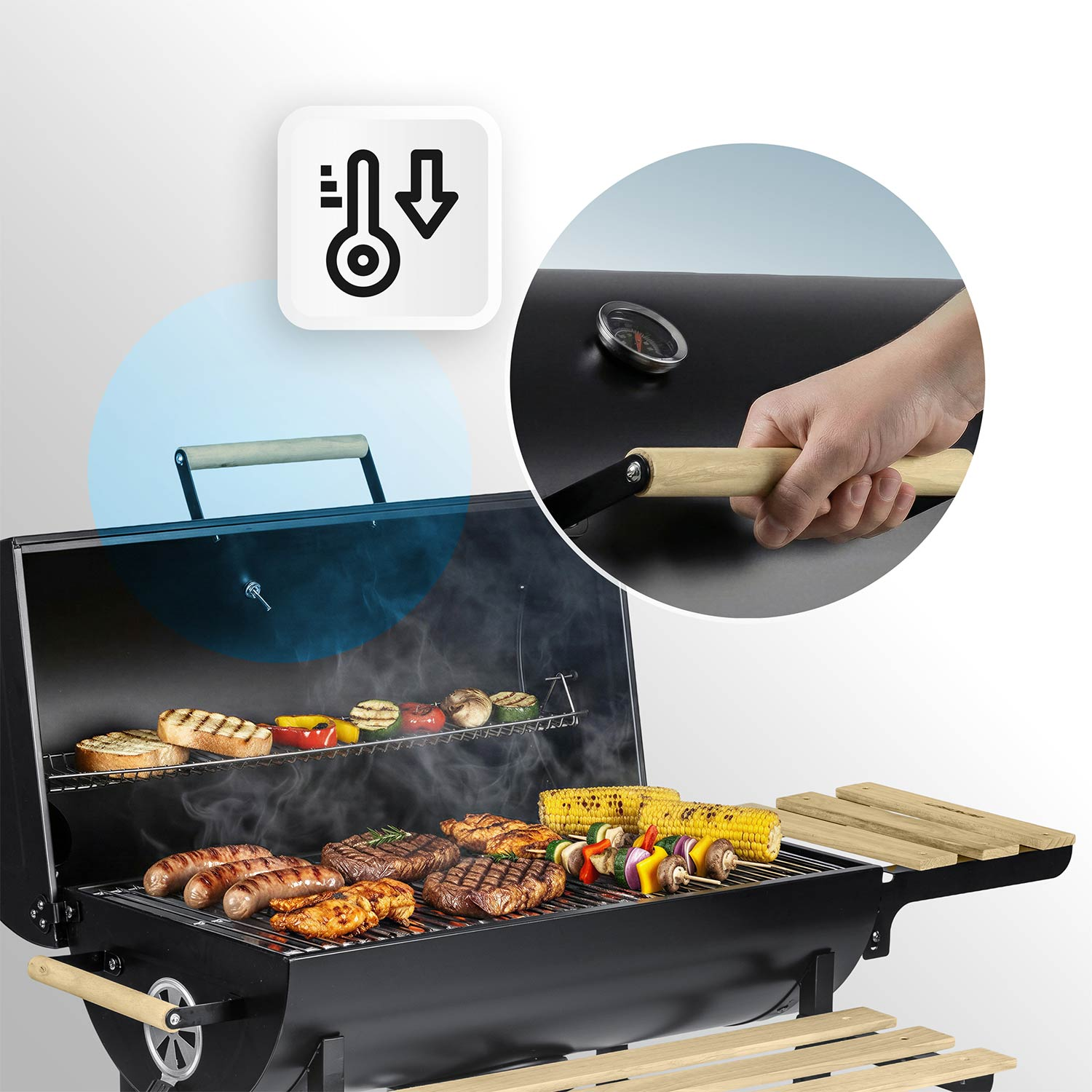 Grill z mięsem, kiełbasami, kolbami kukurydzy i szaszłykami. Termometr pokazuje spadającą temperaturę.