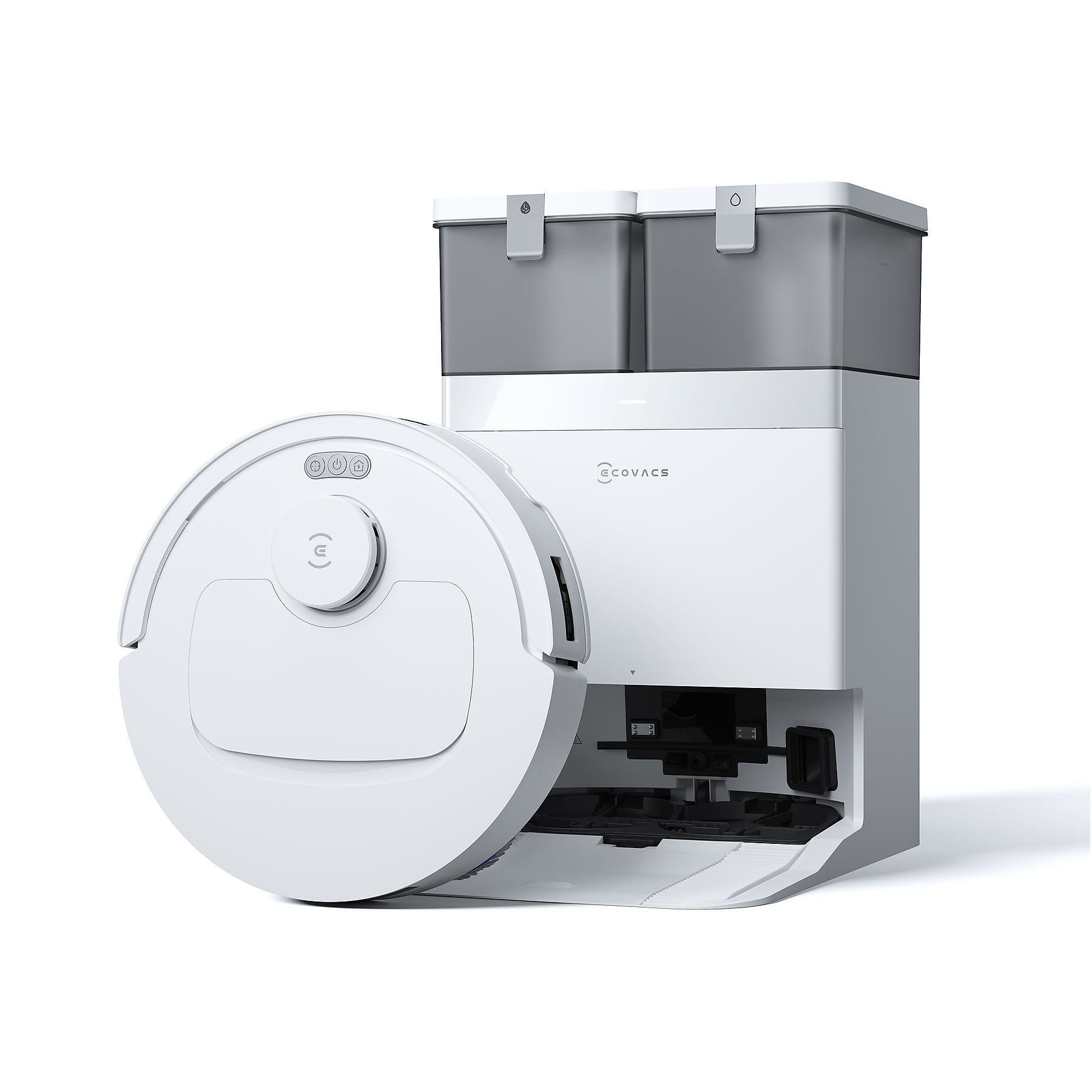 Een witte robotstofzuiger naast een laadstation met twee tanks.