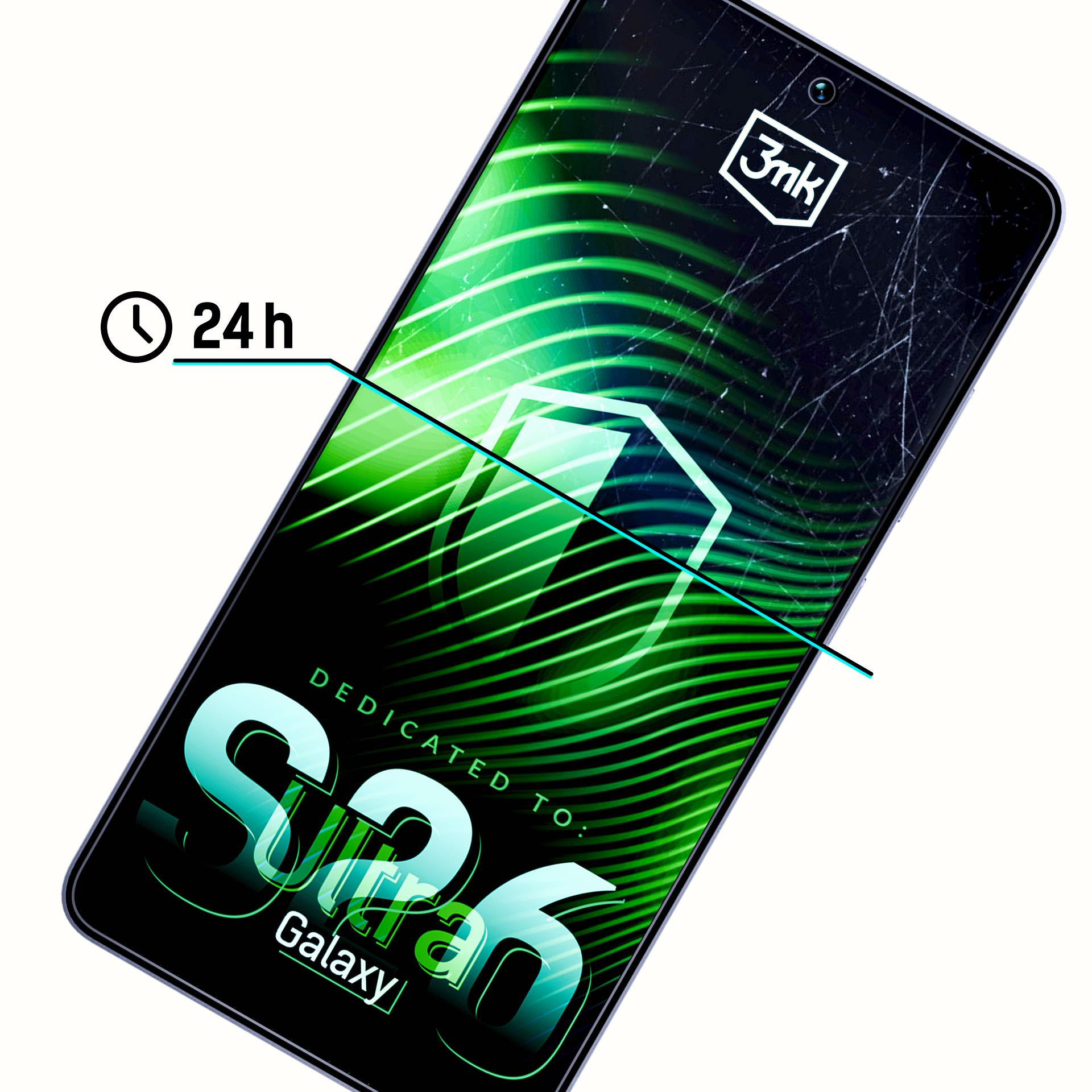 Porysowany smartfon z zielonymi falami i ikoną 24h.