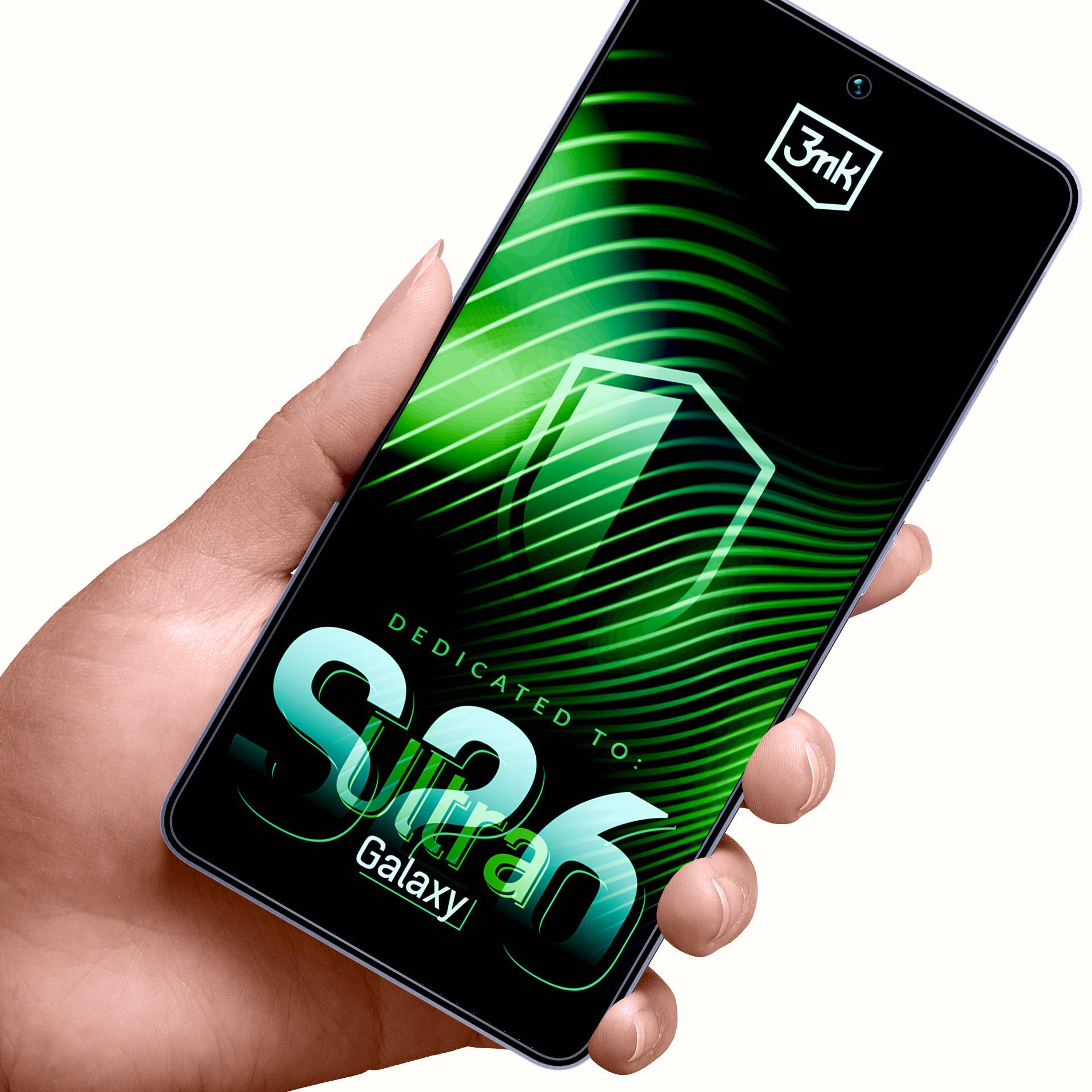 Dłoń trzyma smartfon z zielonym, abstrakcyjnym tłem i logo „3nk”.