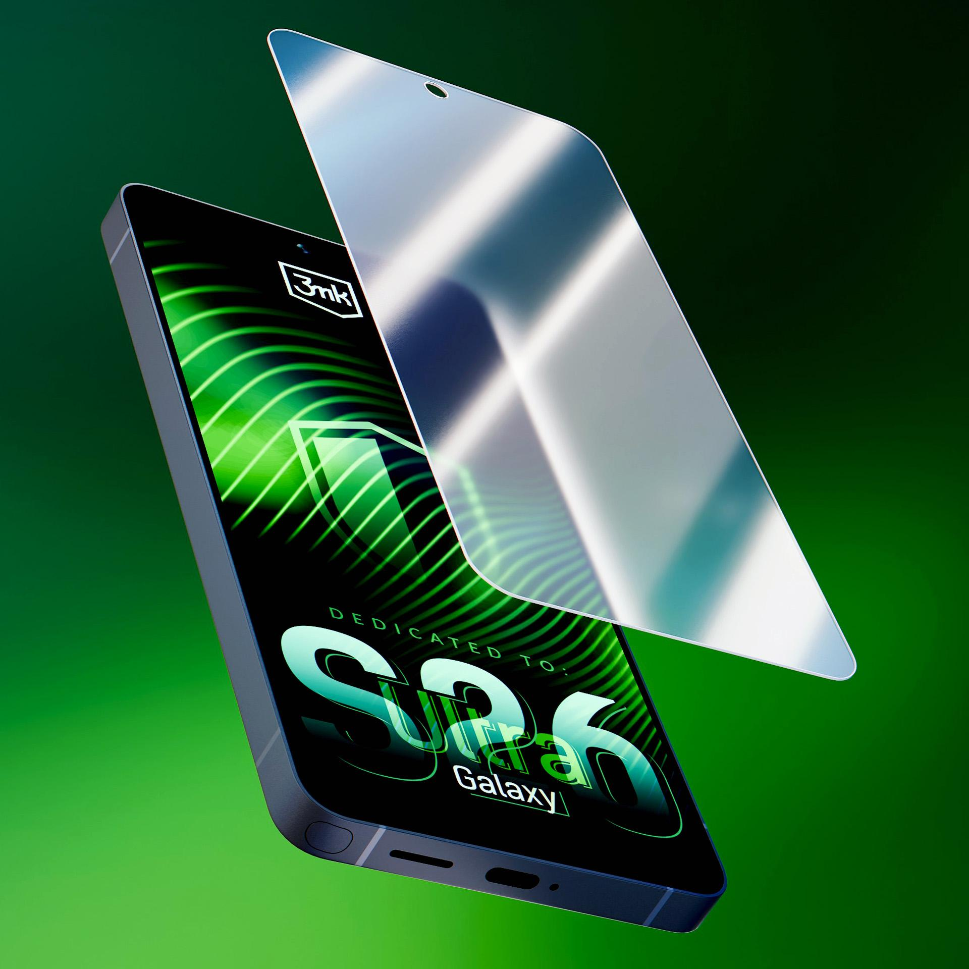 Smartfon z nakładaną osłoną ekranu, na zielonym tle.