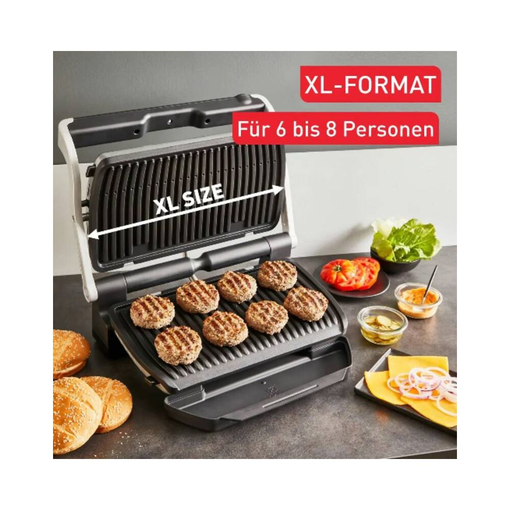 Otwarty grill z ośmioma kotletami, bułkami, sałatą, pomidorami i przyprawami.