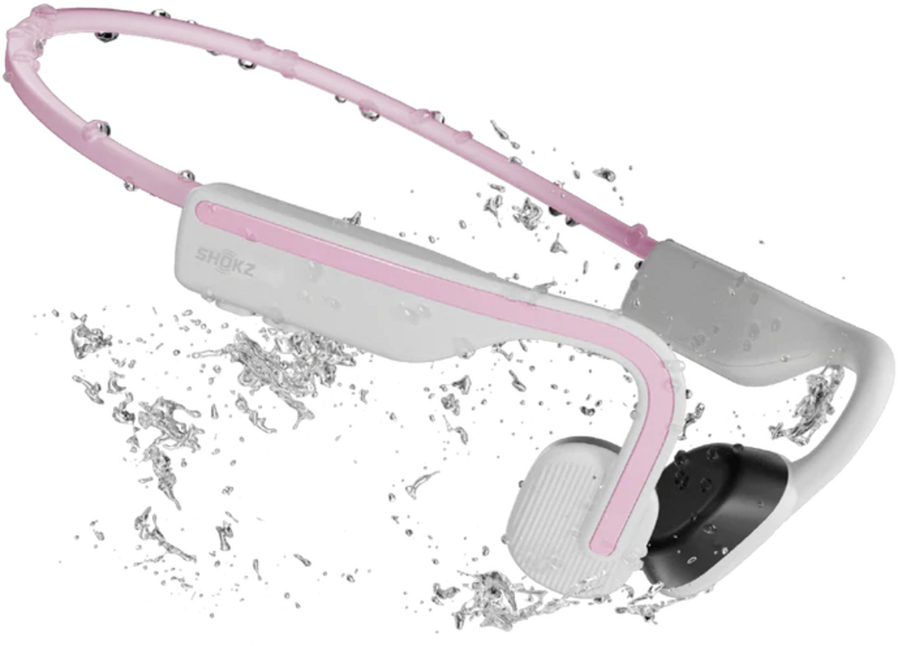 Un paio di cuffie rosa e bianche con schizzi d'acqua.