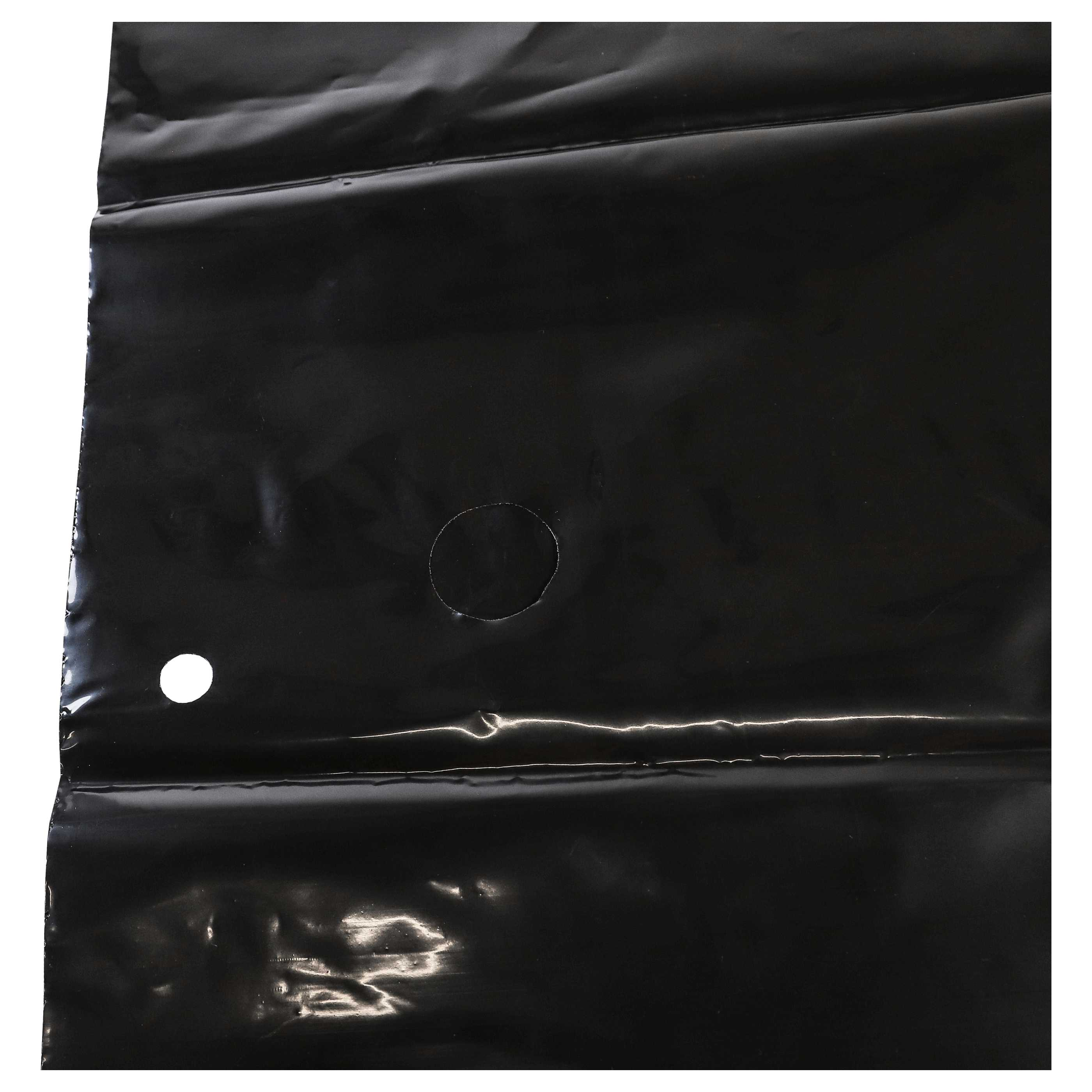 Schwarze Plastikfolie mit Falten und einem Loch.