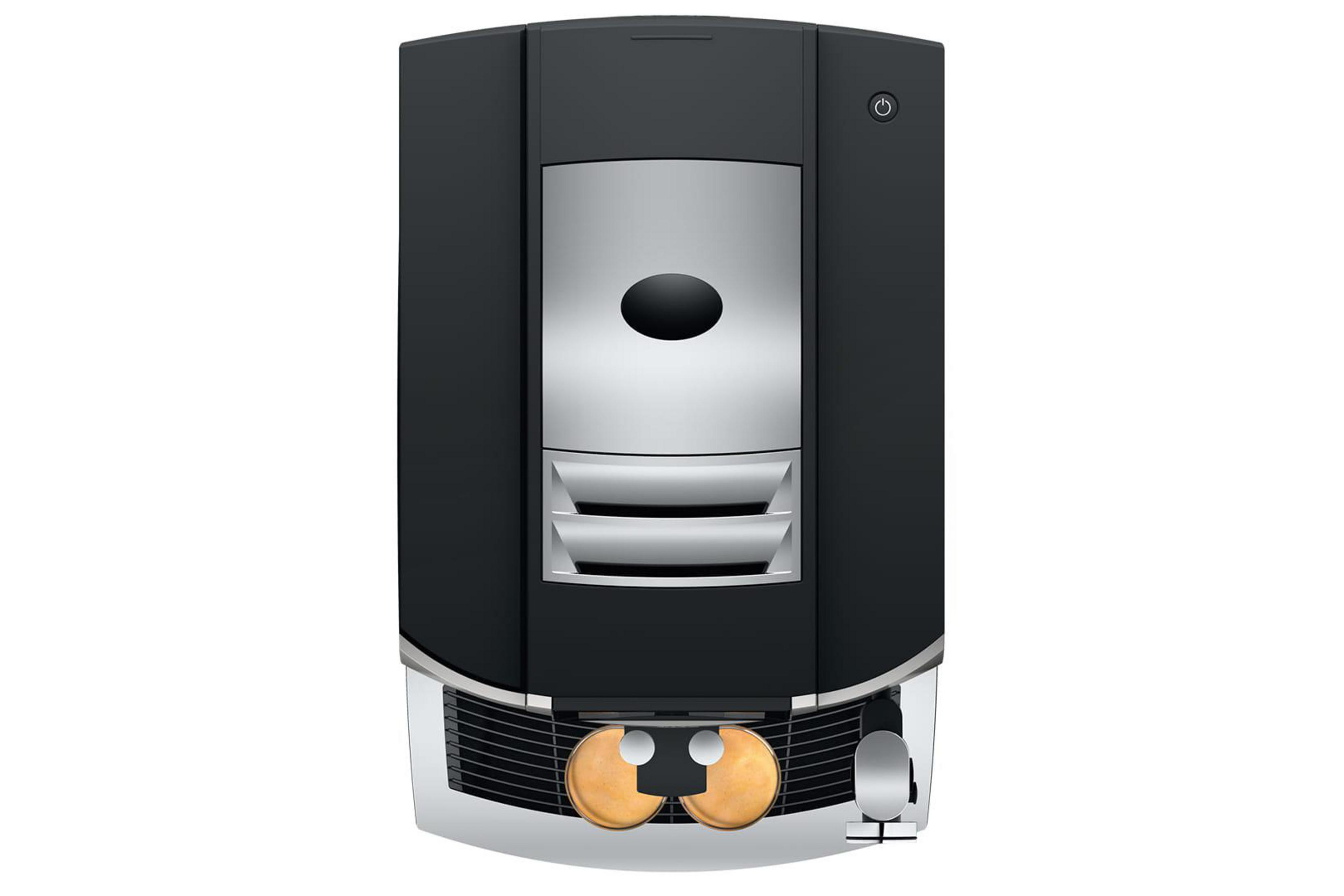 Macchina da caffè nera con accenti argentati e due tazze dorate.