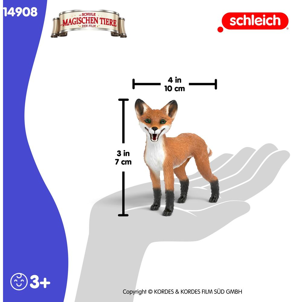 Zabawkowy lis na dłoni. Wymiary: 7 cm wysokości, 10 cm długości.