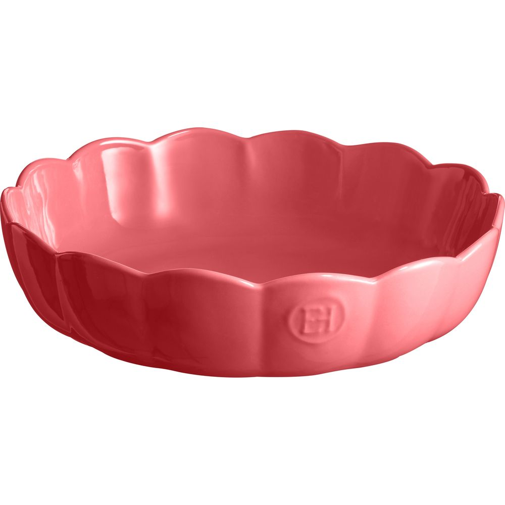 Eine rosafarbene Schüssel mit Blütenblattkante und eingeprägtem Logo.