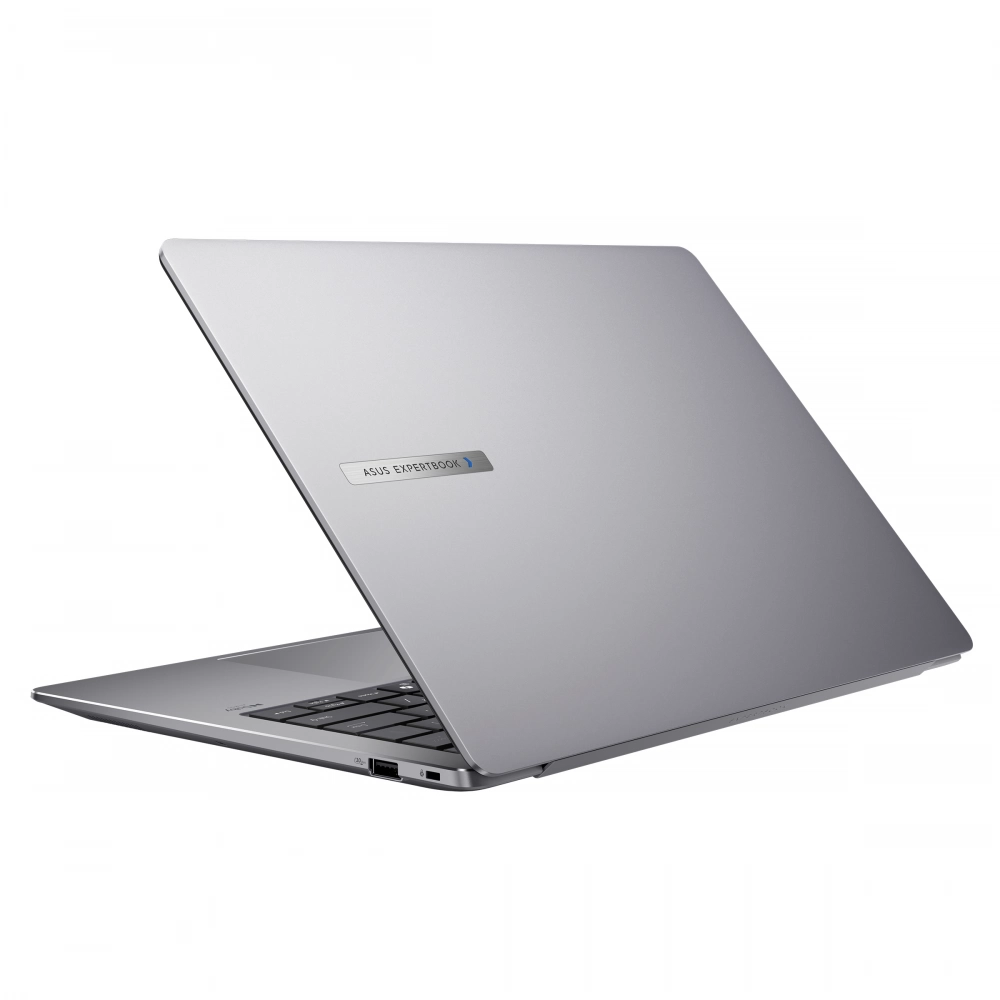 Gümüş renkli Asus Expertbook dizüstü bilgisayar açık, klavye ve portlar görünüyor.