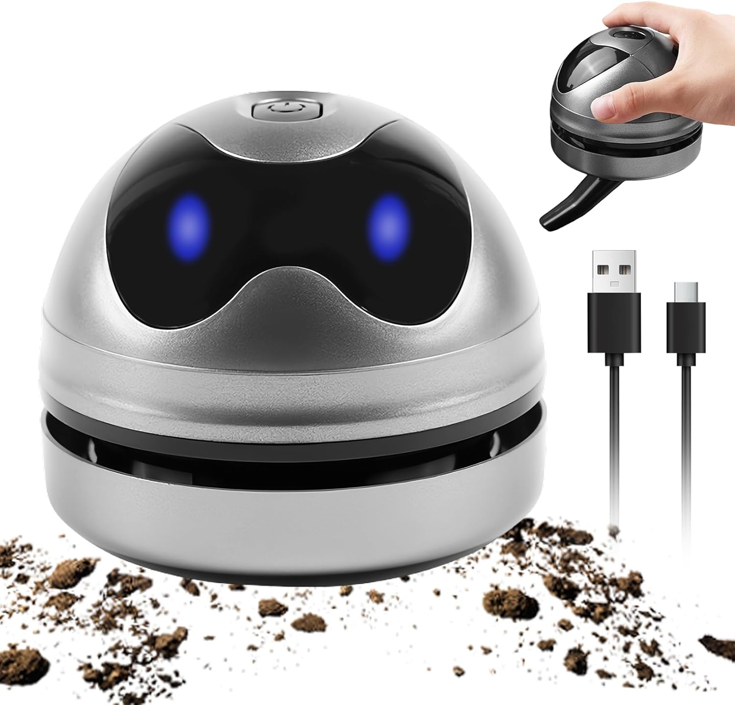 Silberner Mini-Staubsauger mit blauen Lichtern saugt Krümel auf. USB-Kabel daneben.