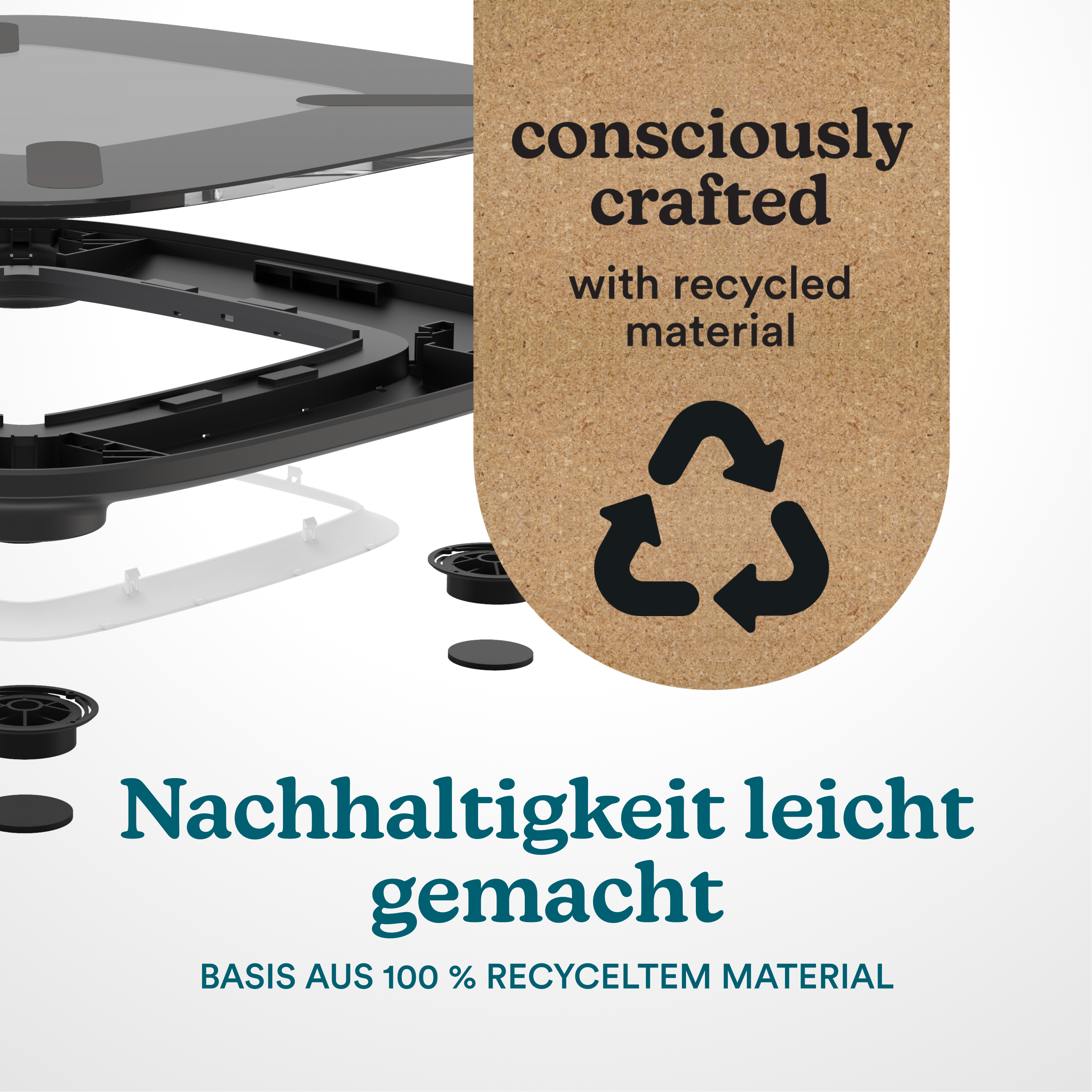 Rozłożone czarne części plastikowe i korek z symbolem recyklingu.