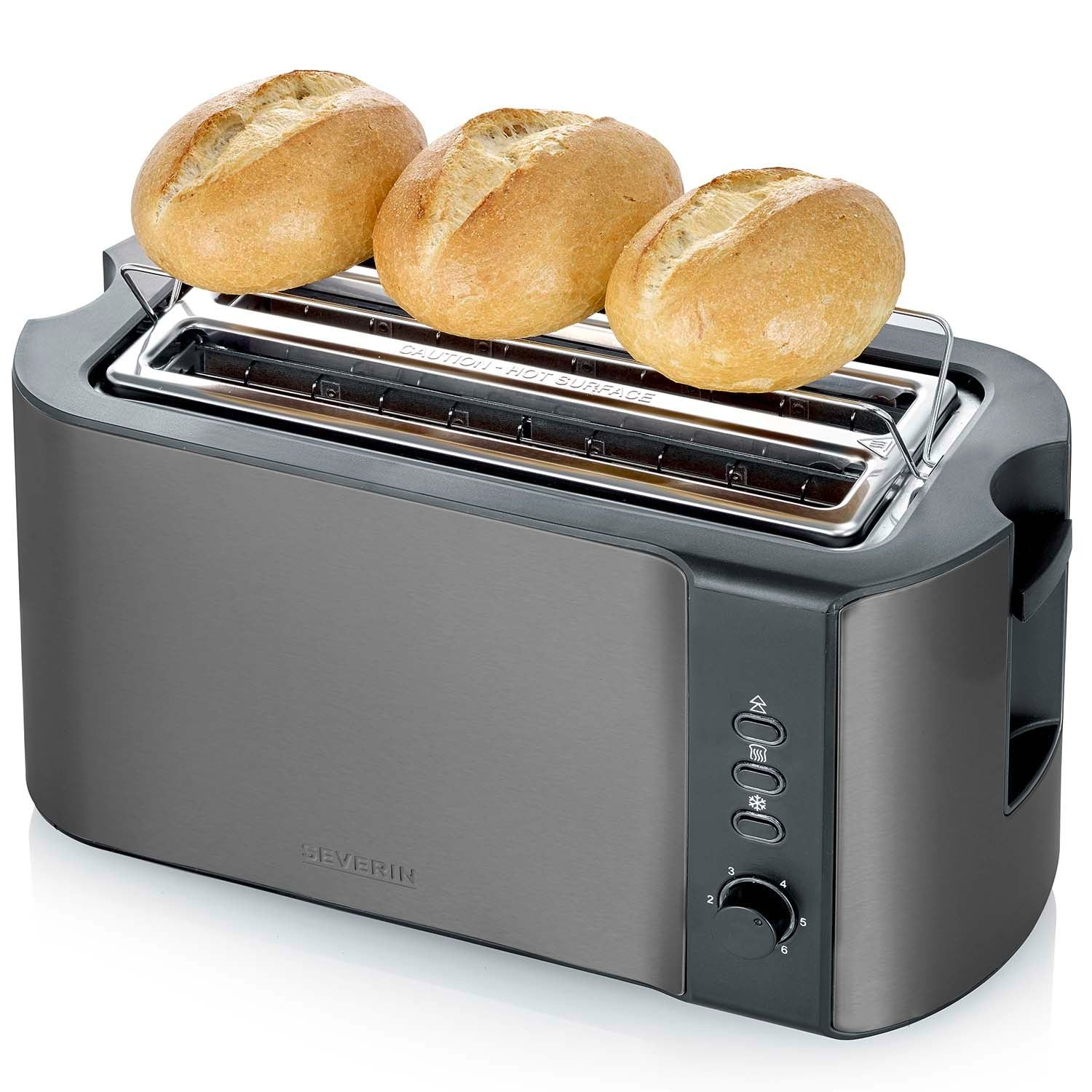Three bread rolls sit on a metallic toaster against a white background.