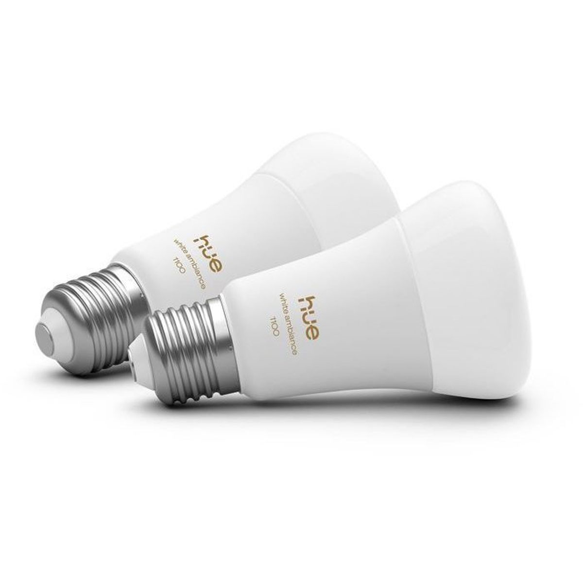Due lampadine Philips Hue bianche con basi argentate giacciono una accanto all'altra.