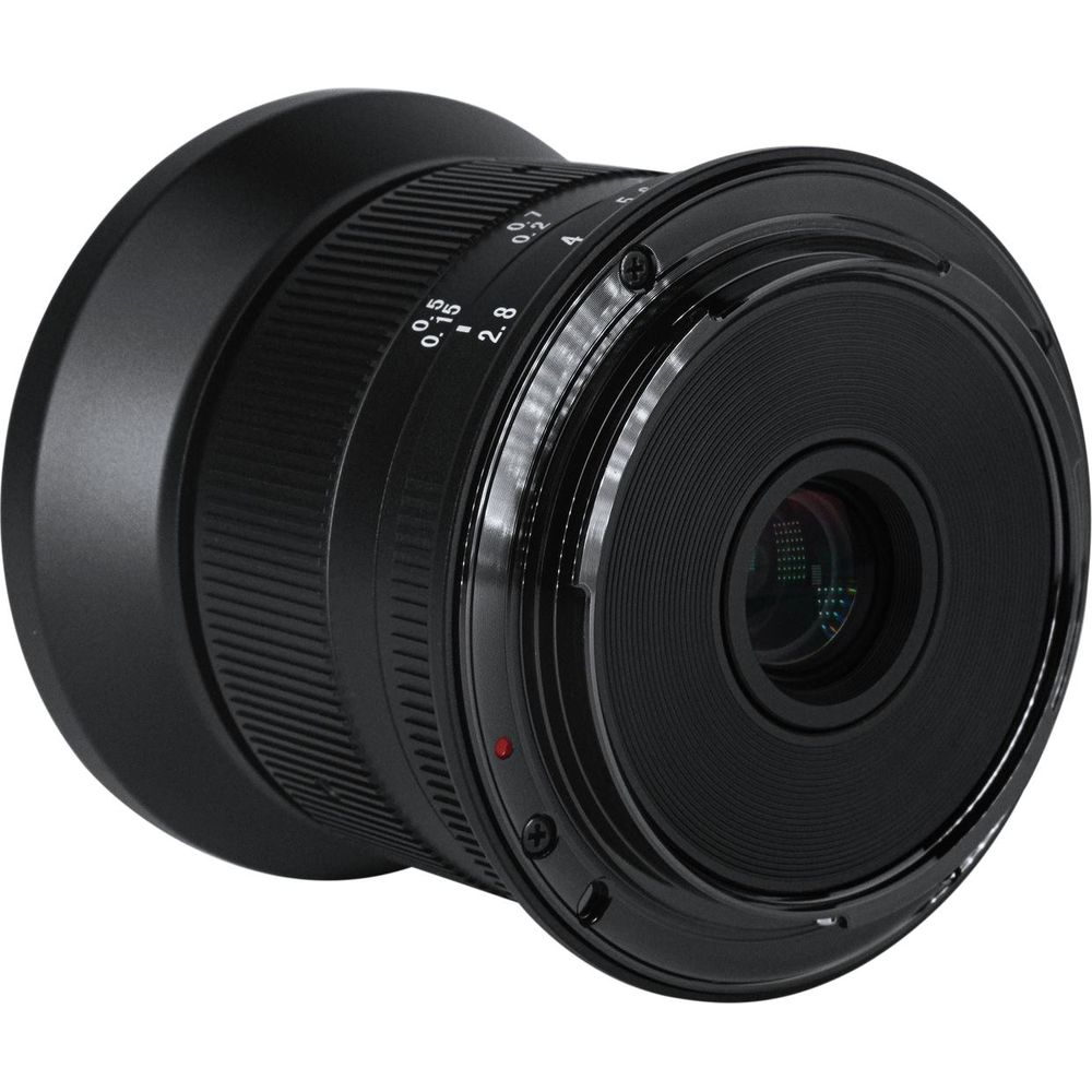 A black camera lens with focus and aperture rings and markings.