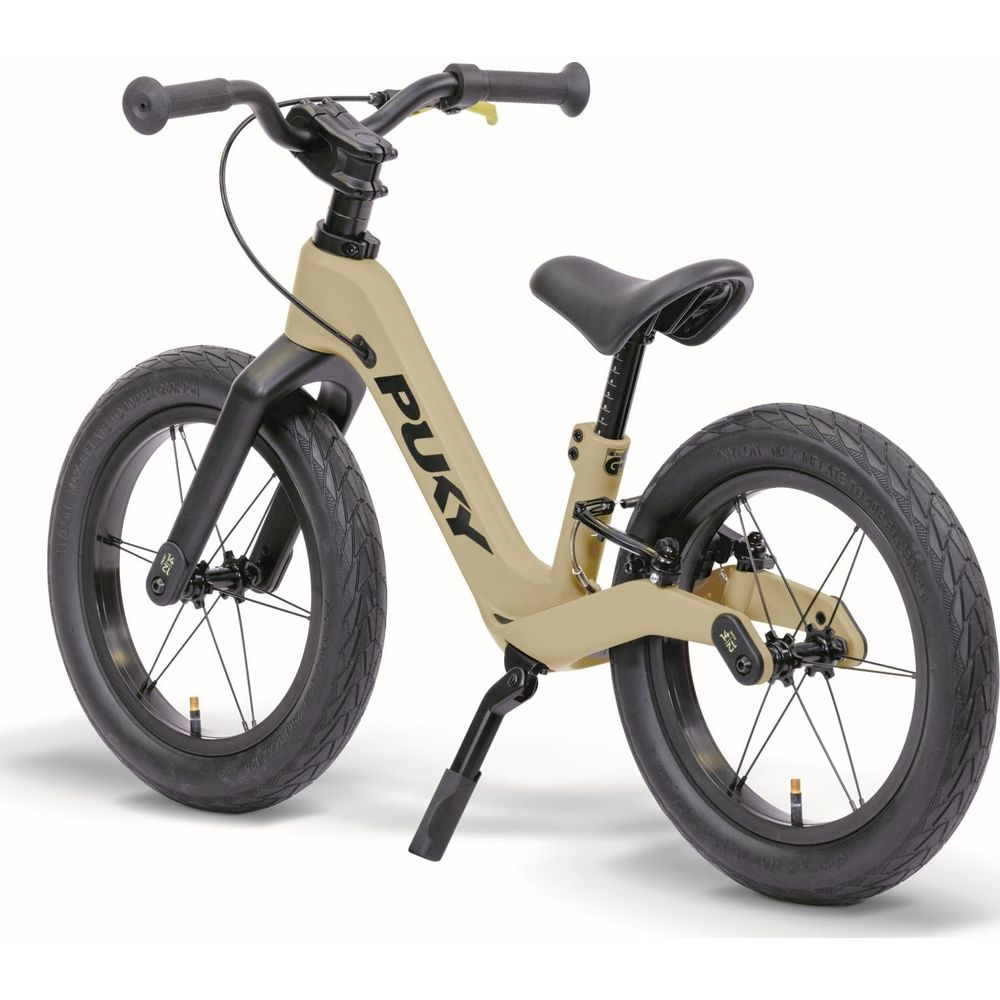Beigefarbenes Kinderfahrrad mit schwarzen Rädern und Sattel. Das Puky-Logo ist sichtbar.