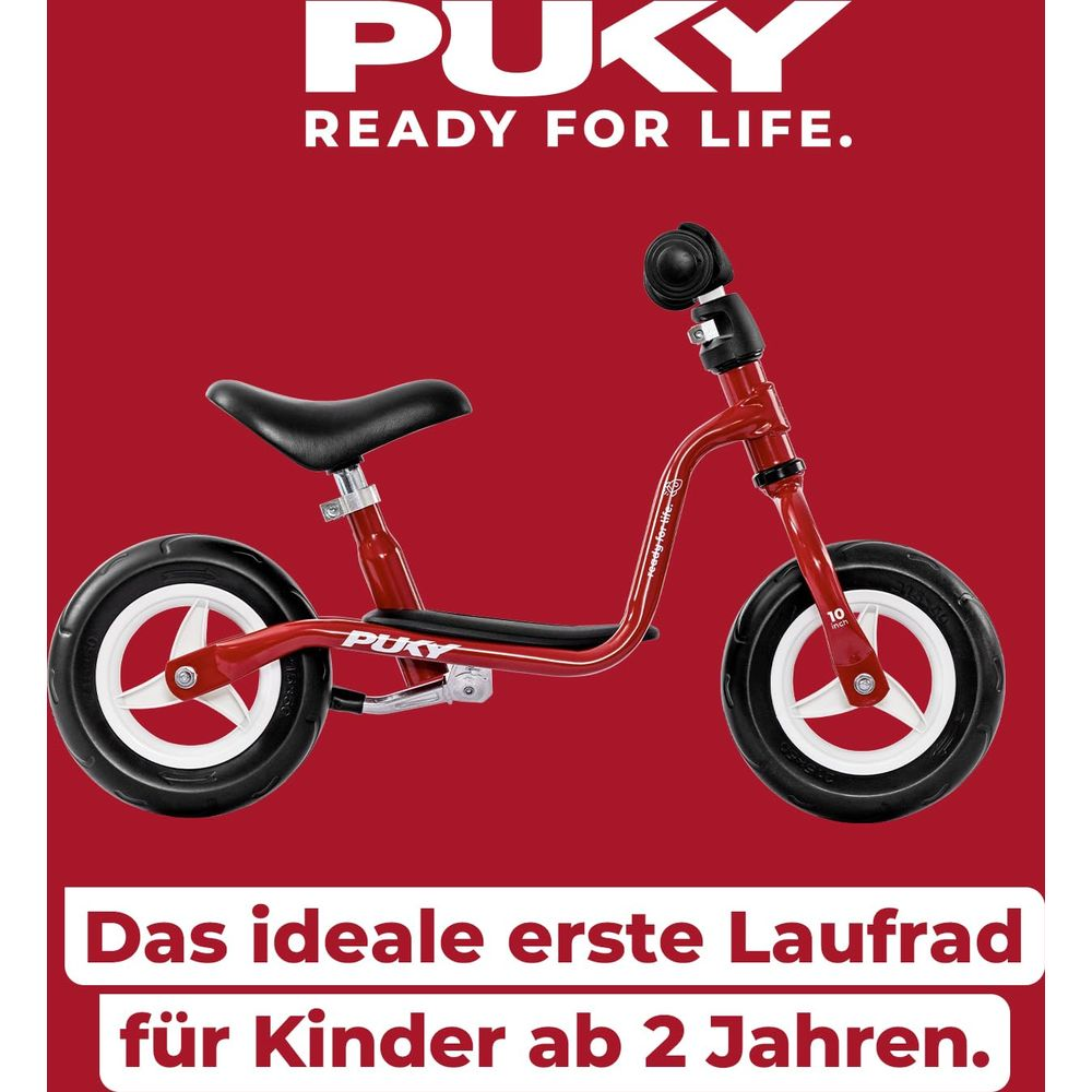 Ein rotes Puky Laufrad mit schwarzen Rädern und weißer Felge.