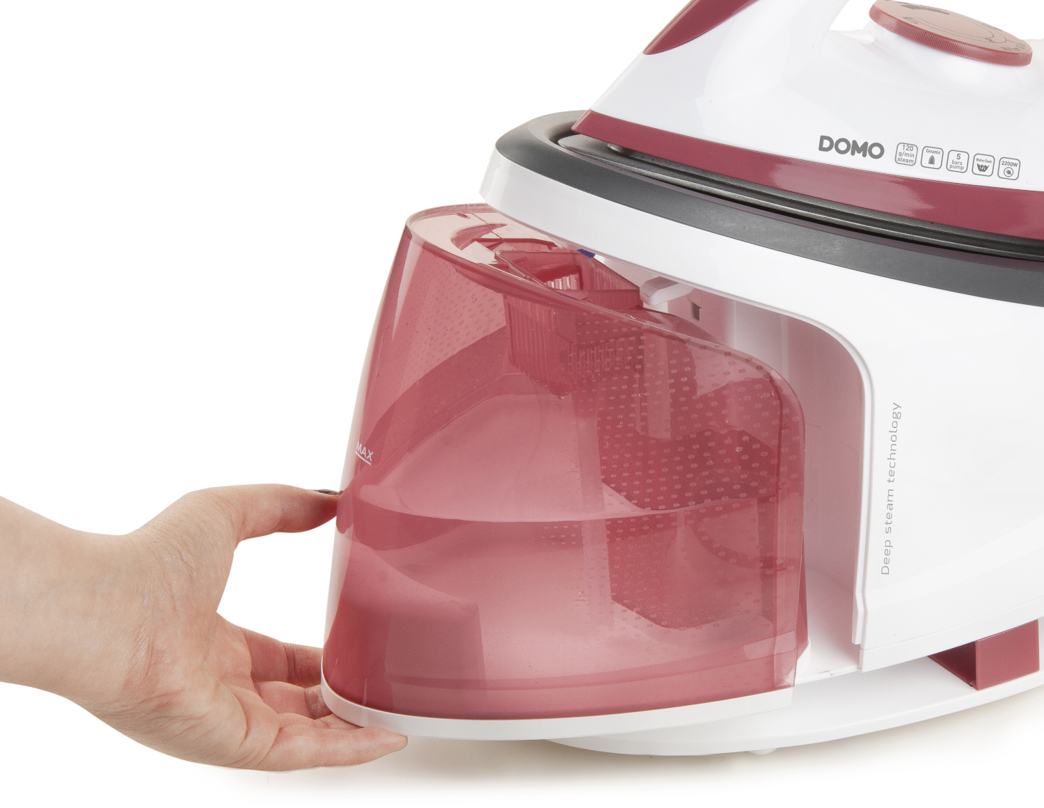 A hand removes a translucent pink water tank from a steam iron.