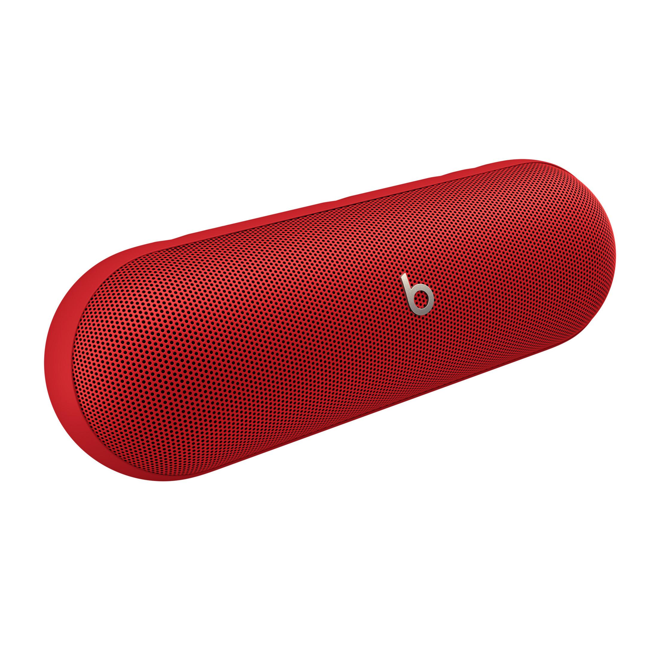 Un altoparlante Beats Pill+ rosso con il logo 'b' su sfondo bianco.
