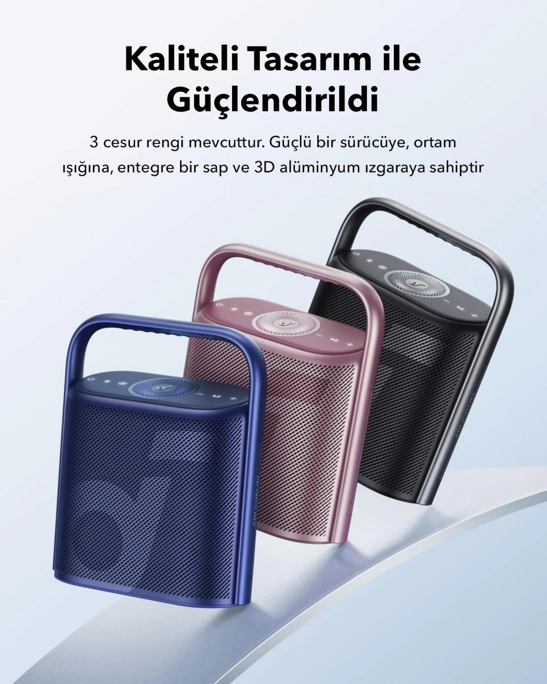 Tre altoparlanti wireless blu, rosa e neri con manici.