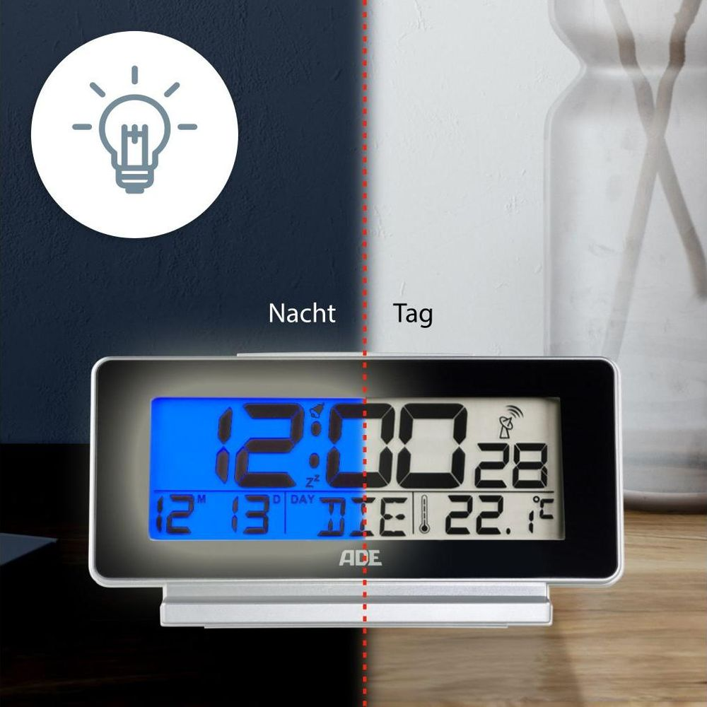 Digitaluhr mit blauem Display, zeigt 12:00 und 22.1°C. Nacht/Tag-Anzeige.