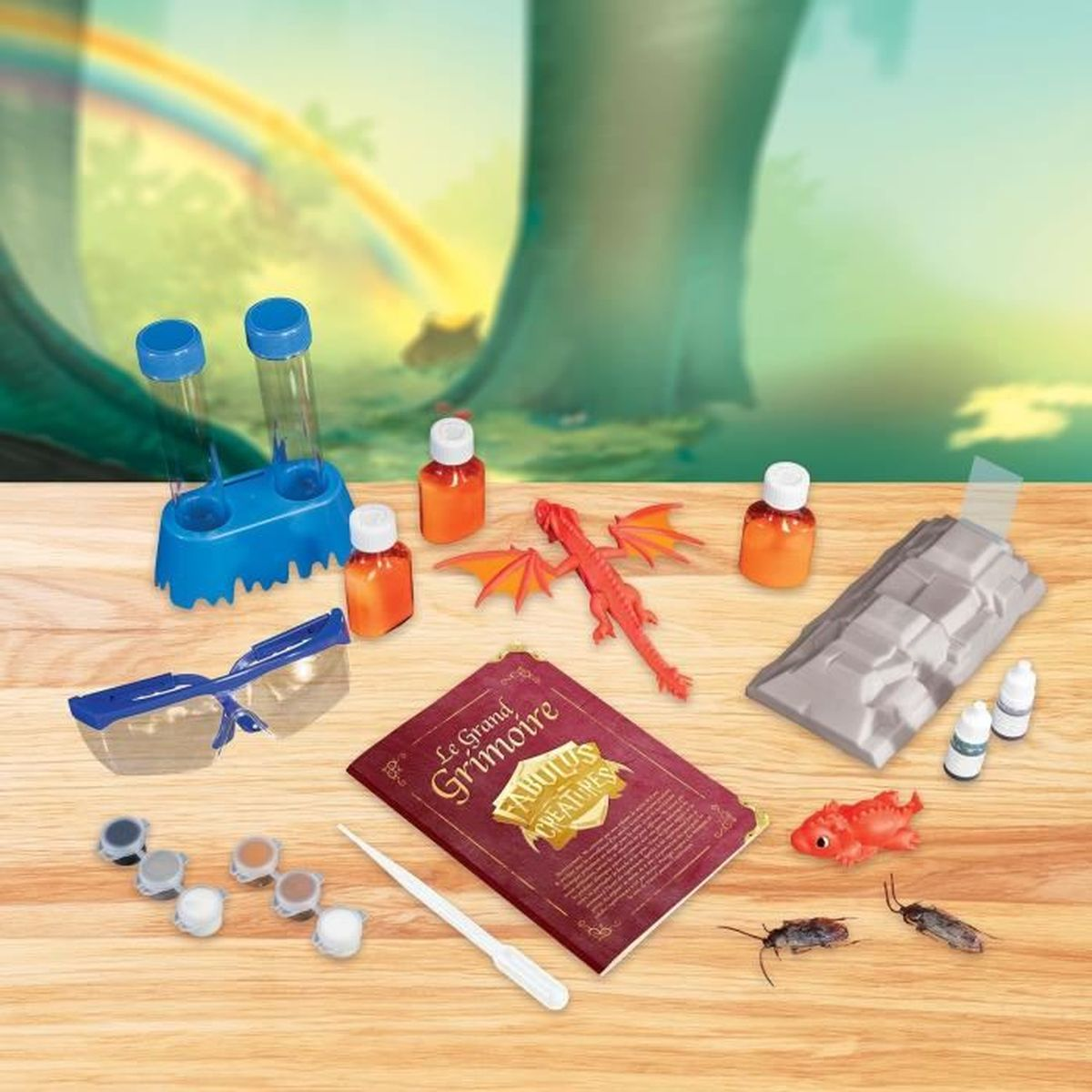 Ein Spielzeug-Drachen-Set mit Fläschchen, Reagenzgläsern, Schutzbrille und einem Buch.