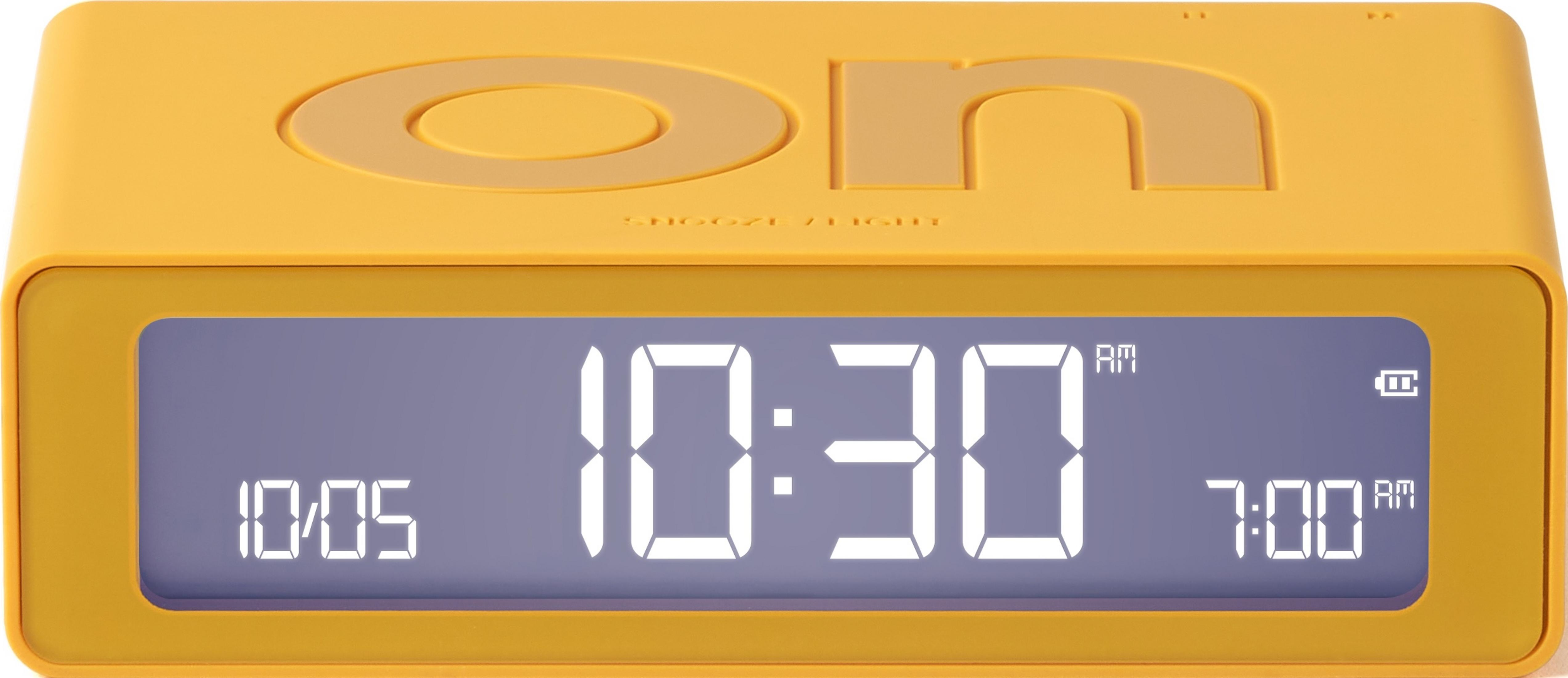 Ein gelber Digitalwecker zeigt 10:30 AM und 7:00 AM an.