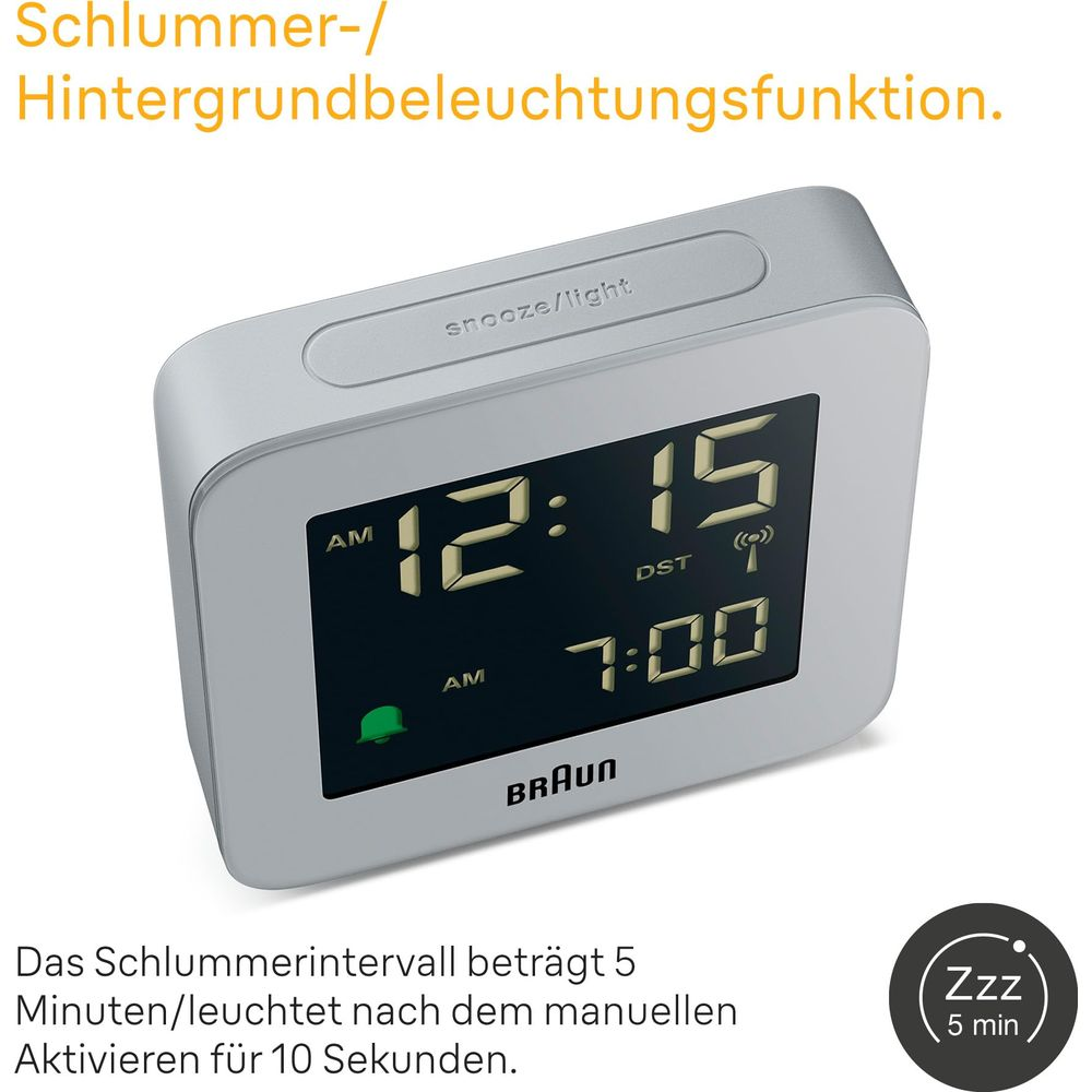 Réveil numérique Braun affiche 12:15 et 7:00. Bouton snooze dessus.