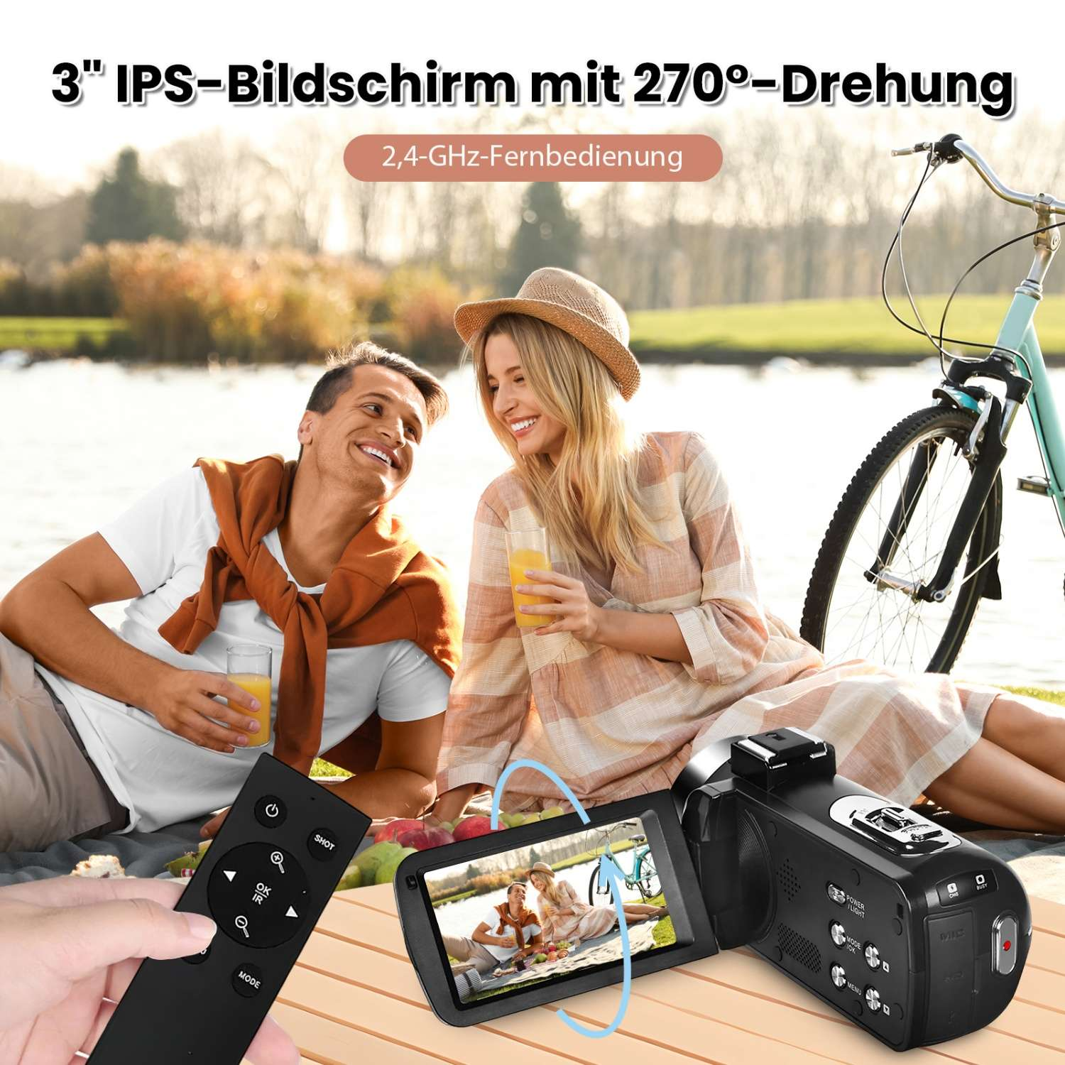 Ein Paar sitzt im Freien. Eine Fernbedienung und ein Camcorder liegen auf einem Tisch.