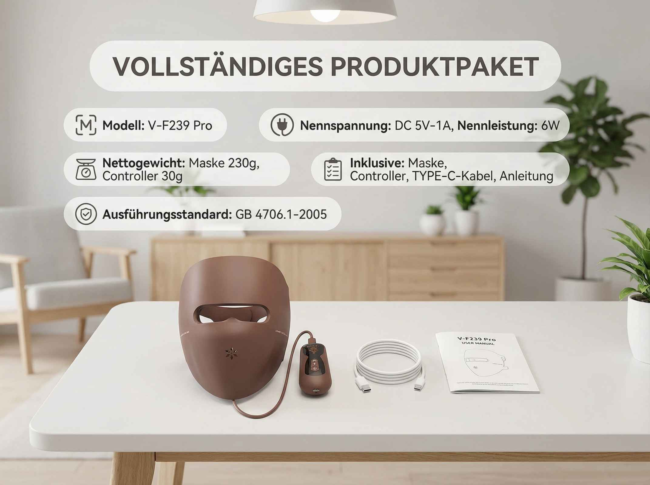 Braune Gesichtsmaske mit Controller, Kabel und Anleitung auf einem Tisch.