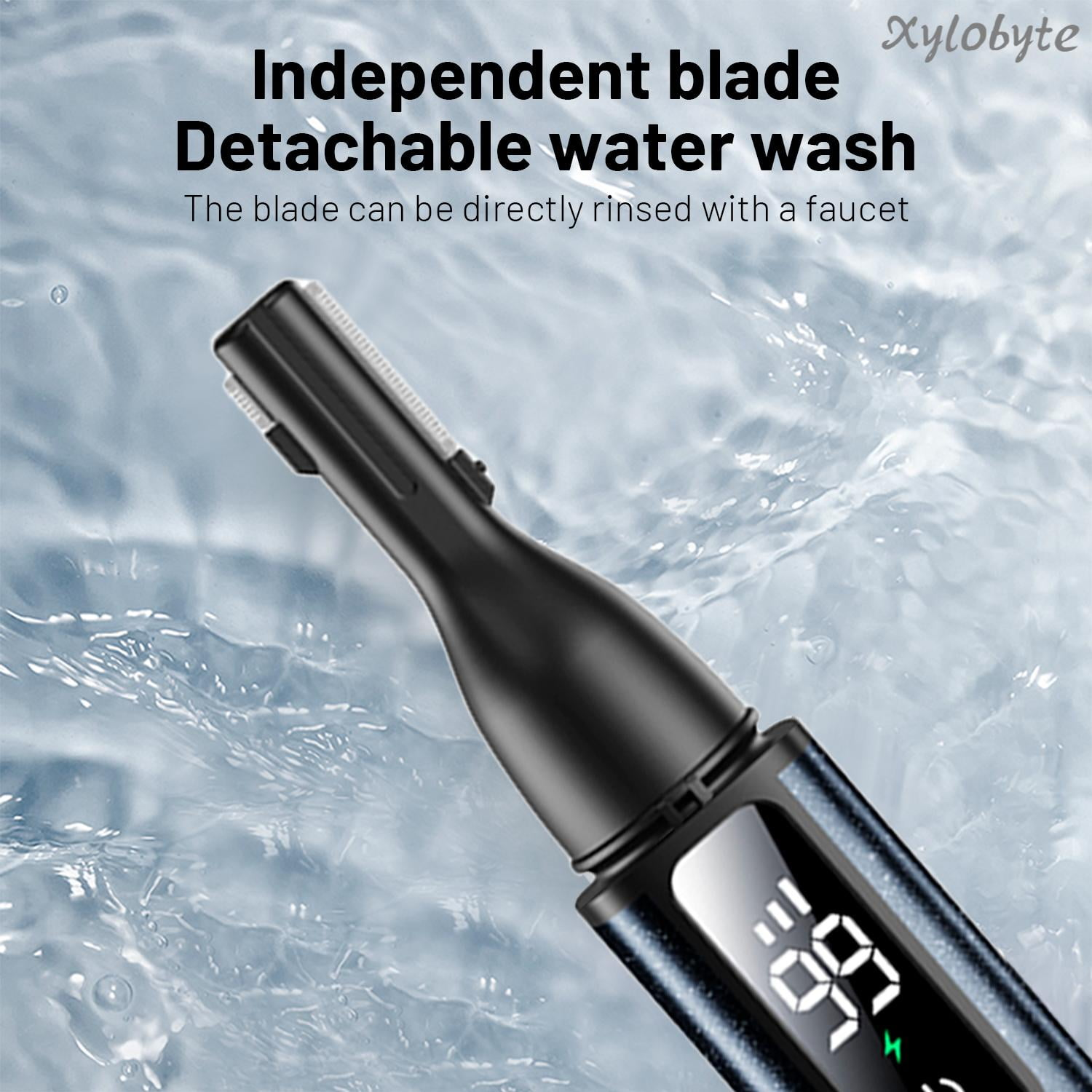 Ein schwarzer Trimmerkopf mit Klinge spritzt Wasser ab. Digitalanzeige zeigt 99.