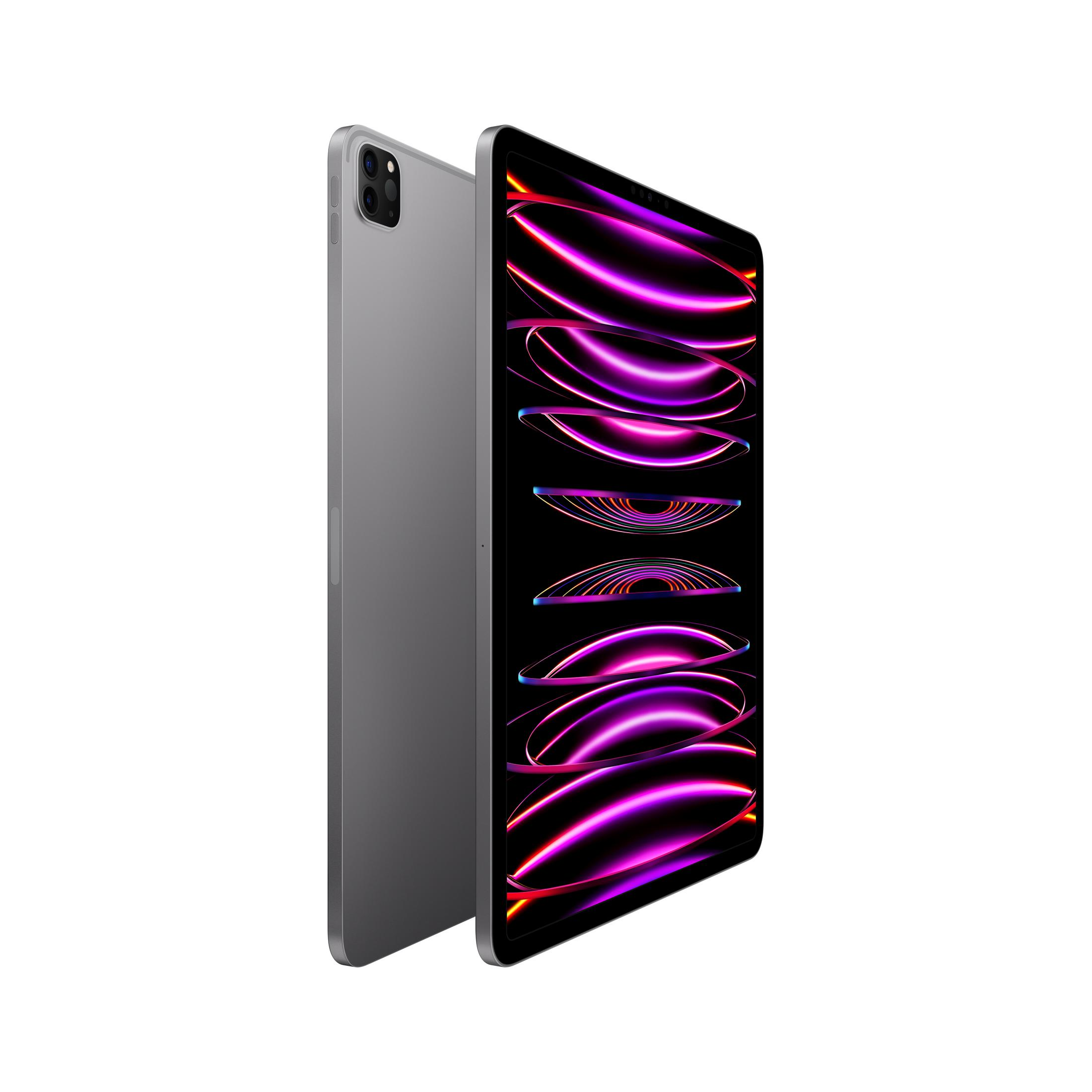 Un iPad Pro argentato con uno sfondo viola e rosa.