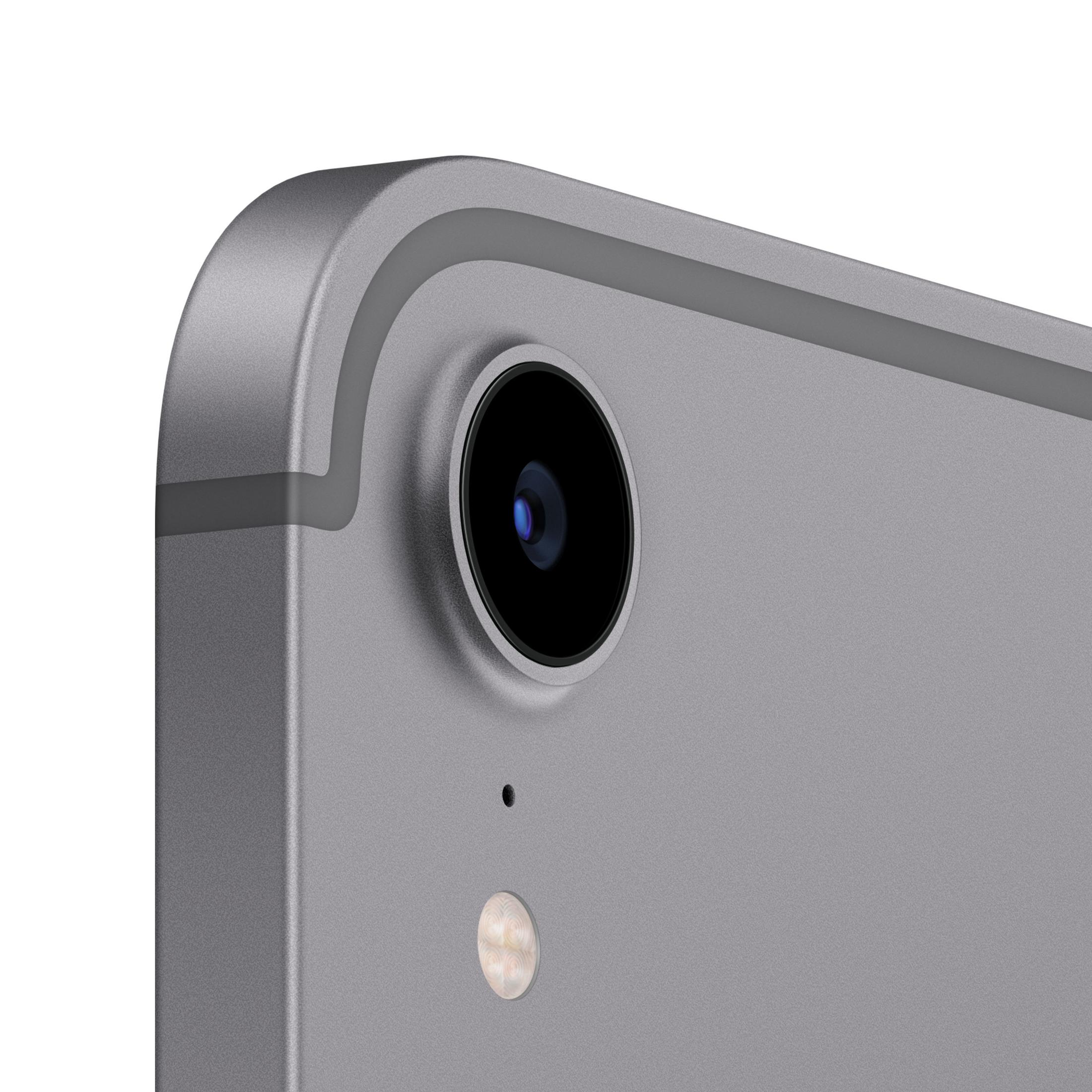 Gros plan de l'arrière d'une tablette grise avec appareil photo et flash.
