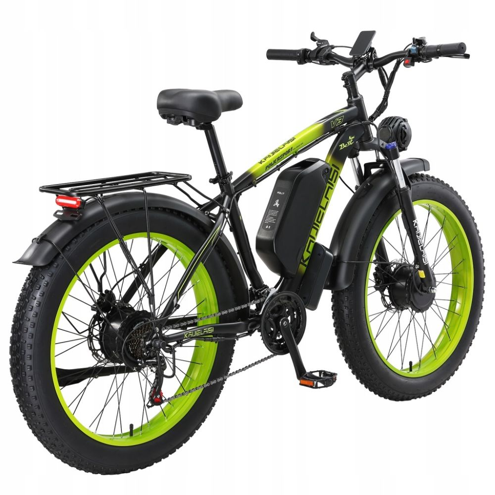 Una e-bike nera e verde con pneumatici larghi e portapacchi posteriore.