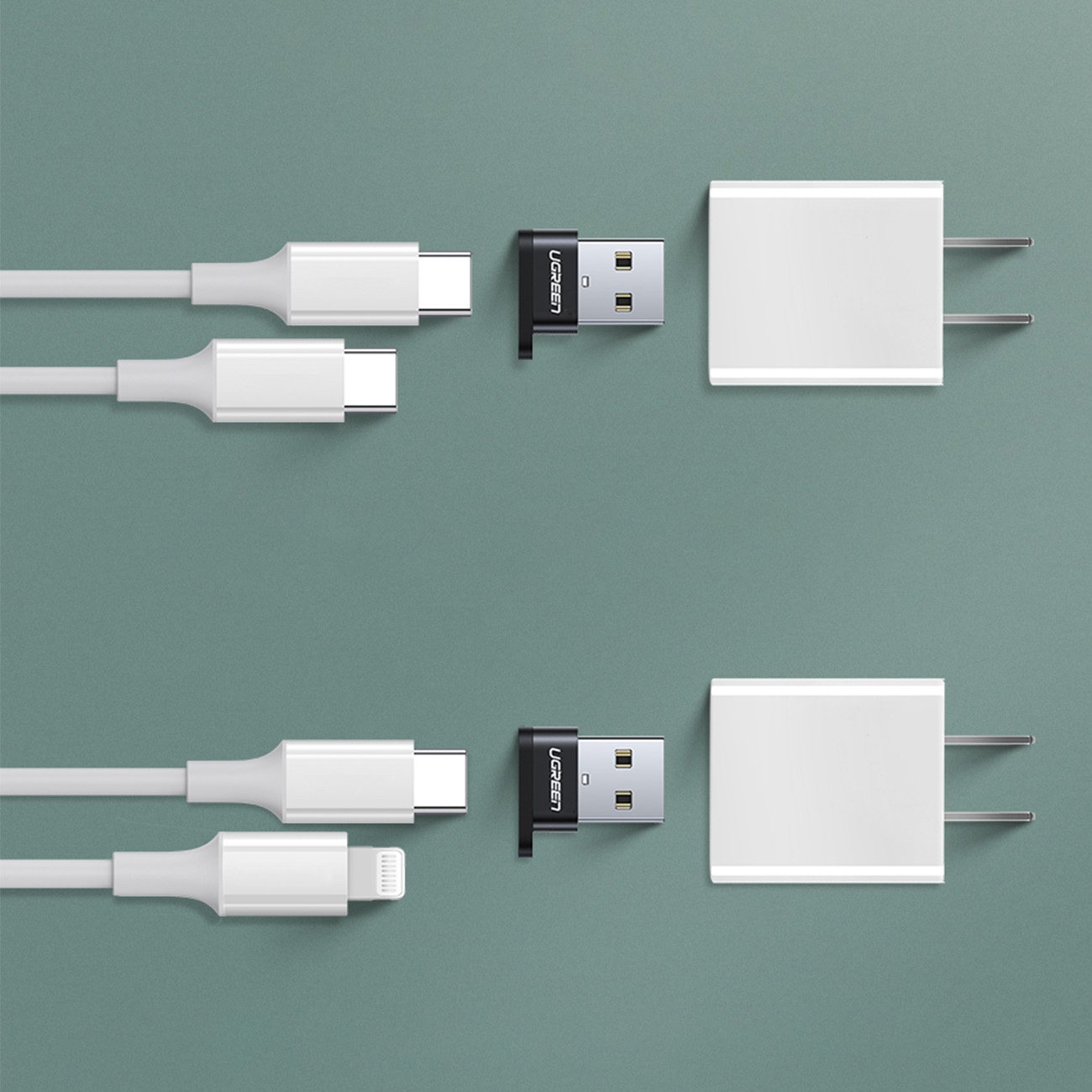 Adaptörlerin yanında USB-C ve Lightning konektörlü iki beyaz şarj kablosu.