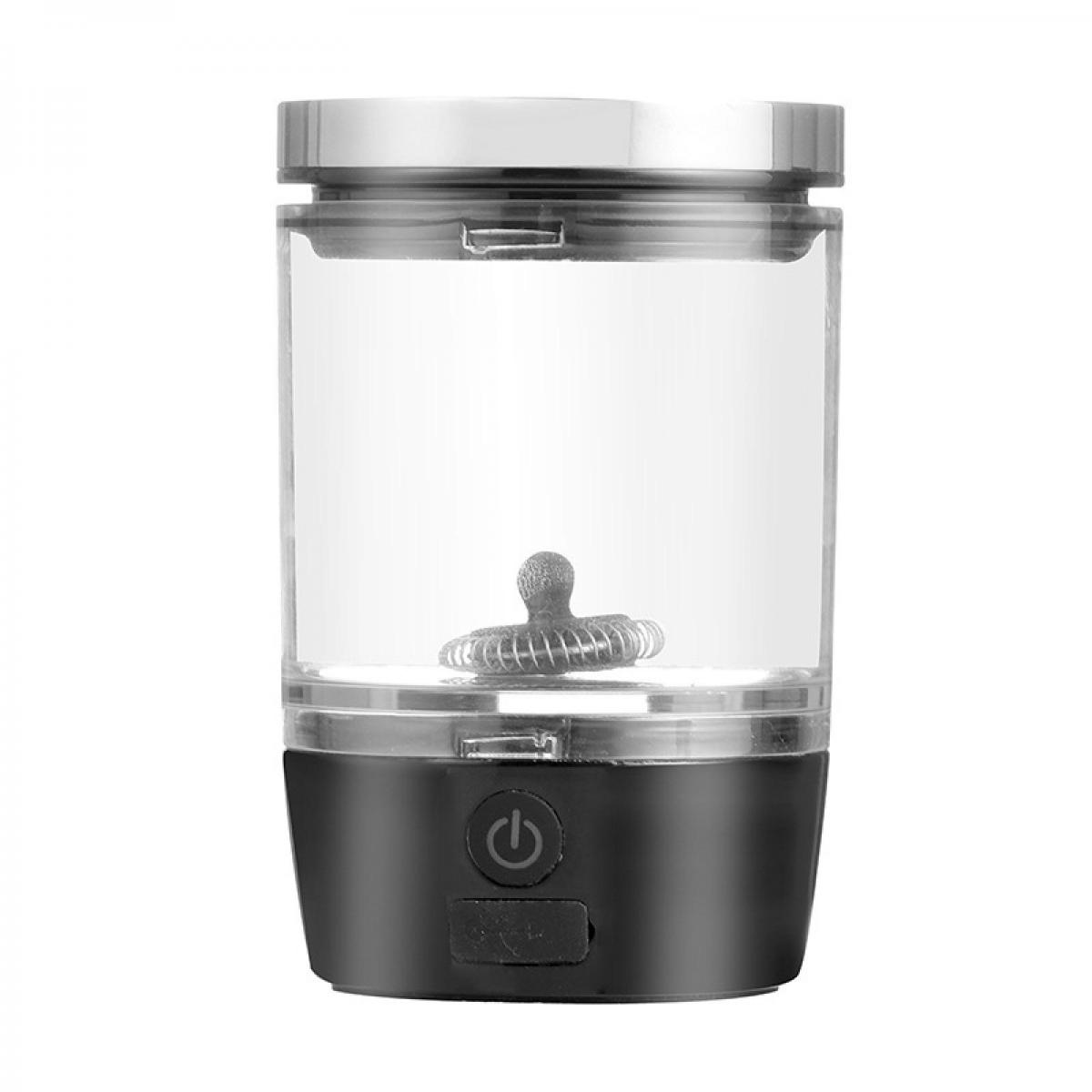 Ein transparenter Mixer mit schwarzem Sockel und Power-Symbol.
