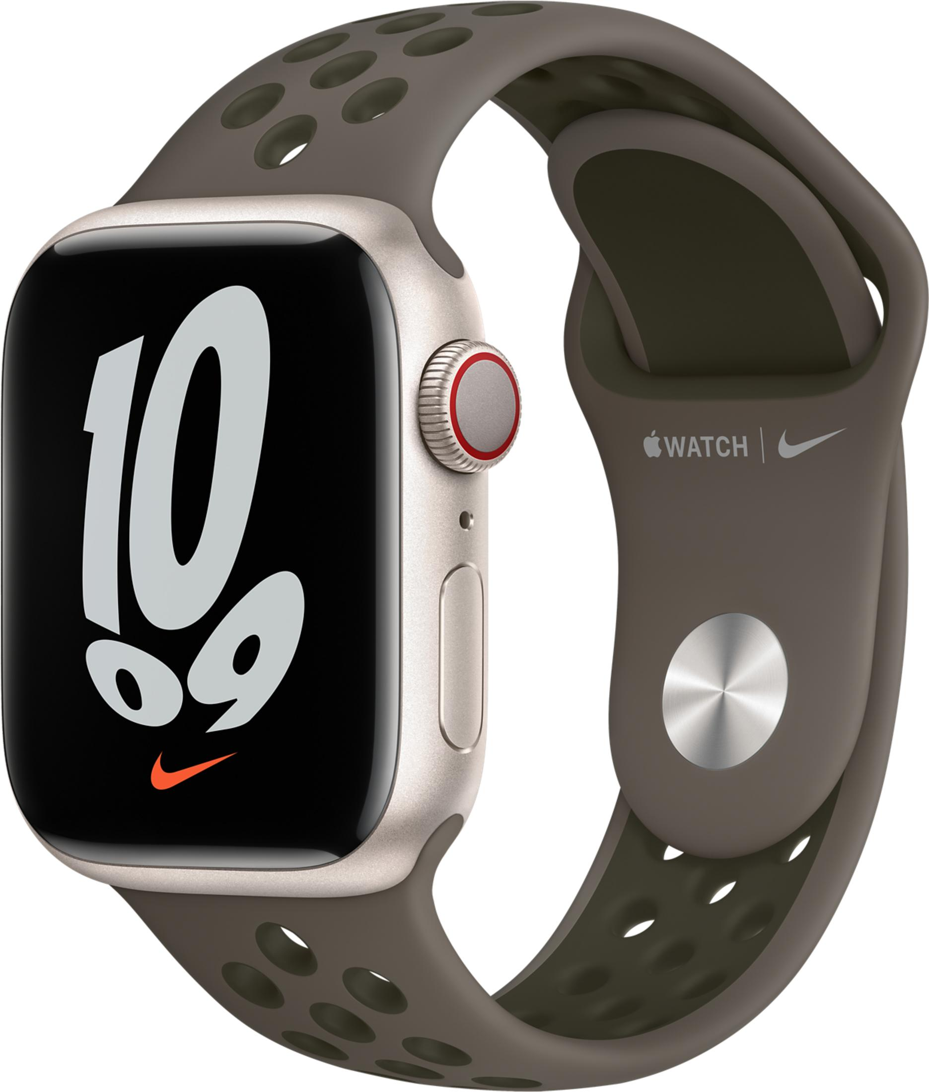 A silver Apple Watch Nike with a brown band shows "10:09" on its screen.