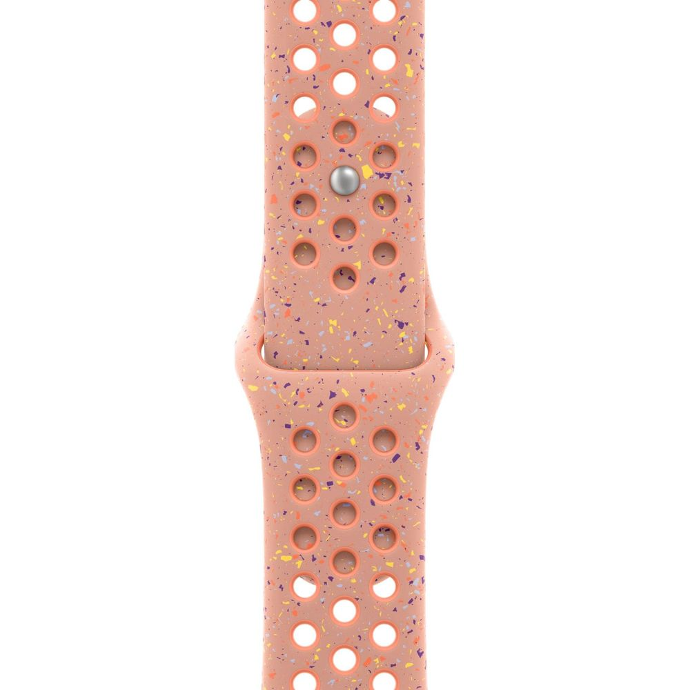 Brzoskwiniowa opaska na zegarek z kolorowymi cętkami i perforacjami.
