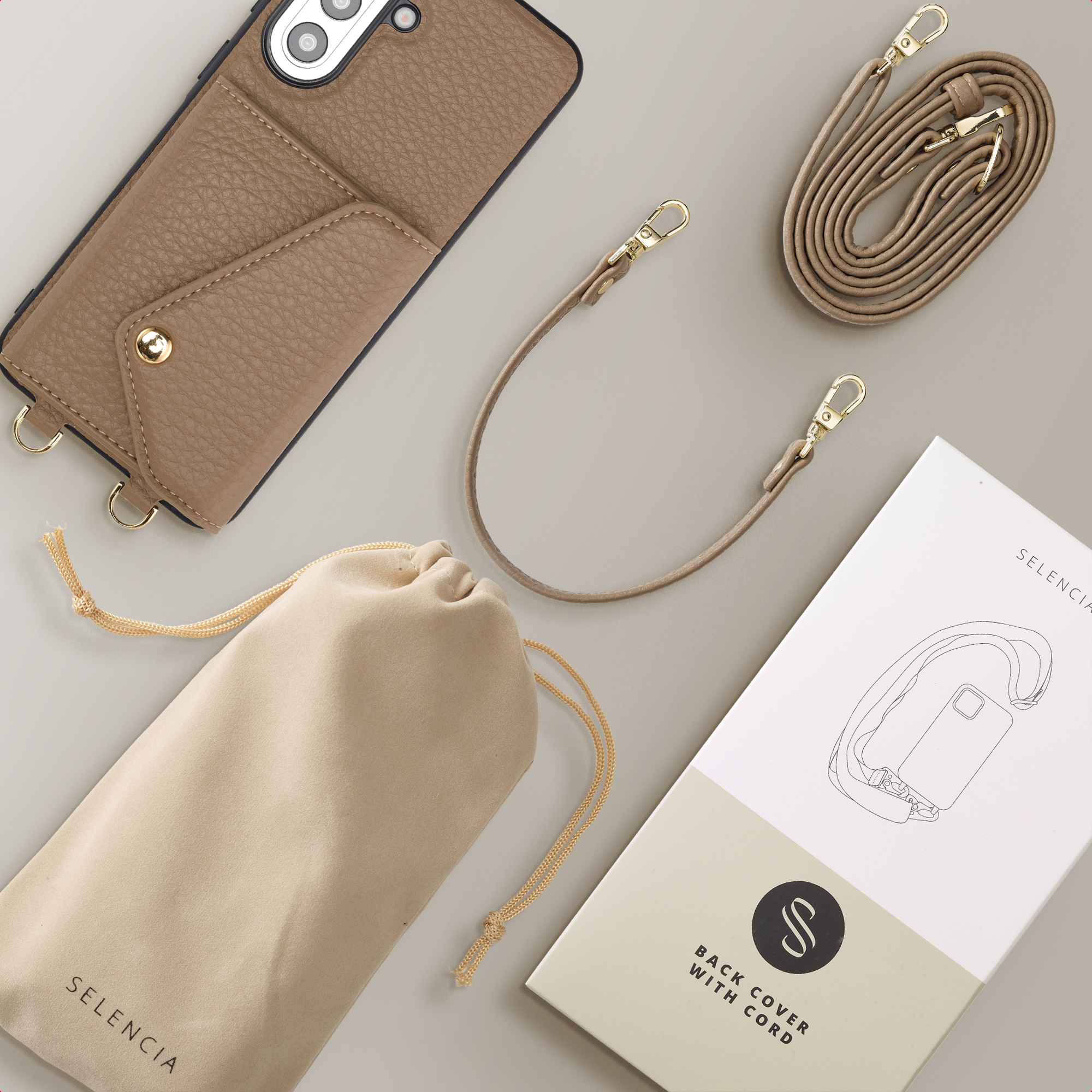 Étui de téléphone marron avec pochette, cordon, sac et emballage.