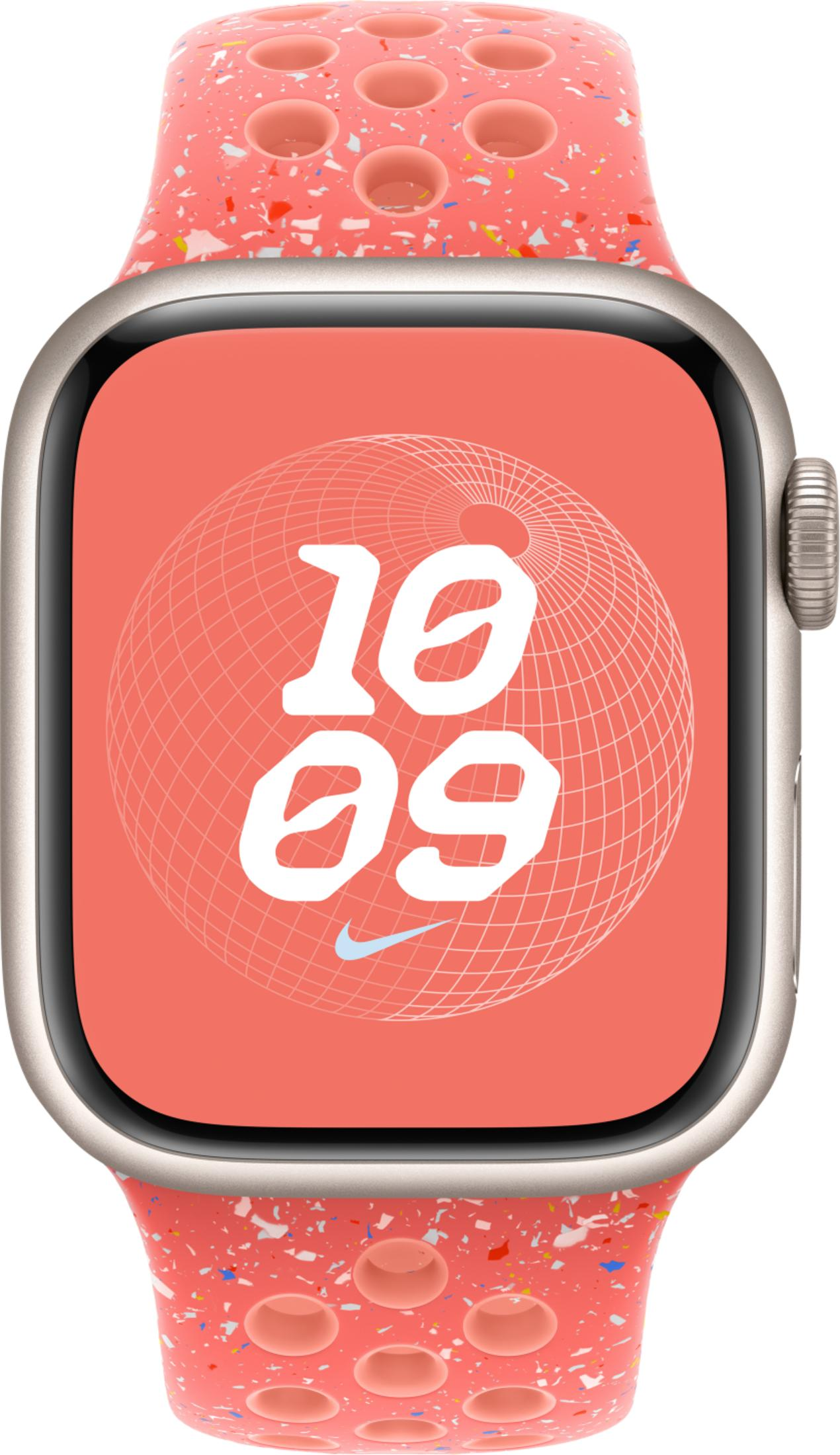 A pink Apple Watch with a speckled pattern of colorful flecks and circular cutouts.
