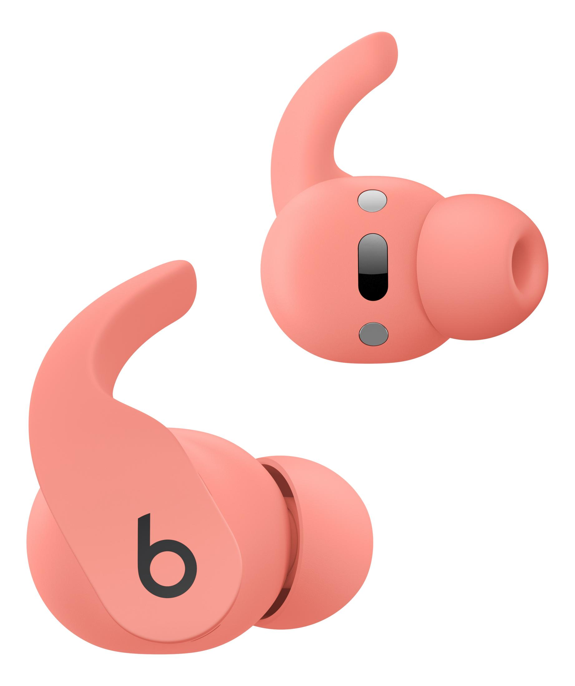 Dwa koralowe bezprzewodowe słuchawki z zaczepami i logo Beats.