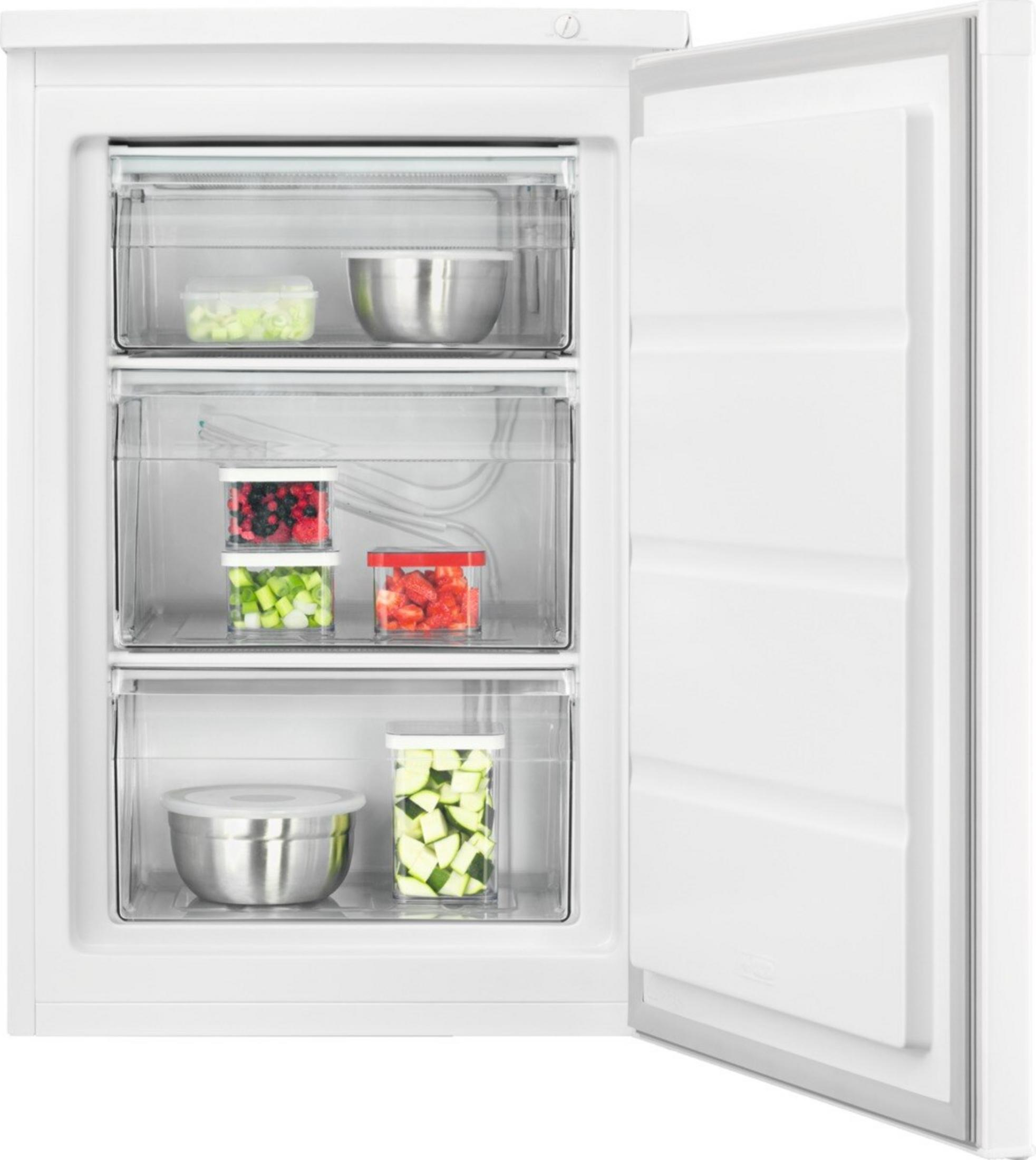 Congelador con tres cajones llenos de frutas y verduras.