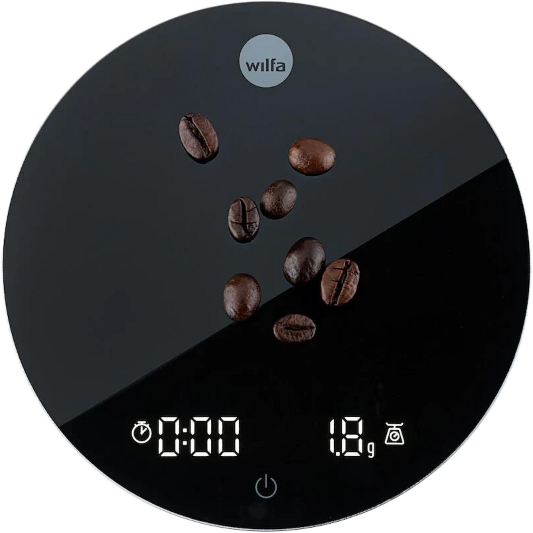 Ein Wilfa-Logo auf einer schwarzen Waage mit Kaffeebohnen.