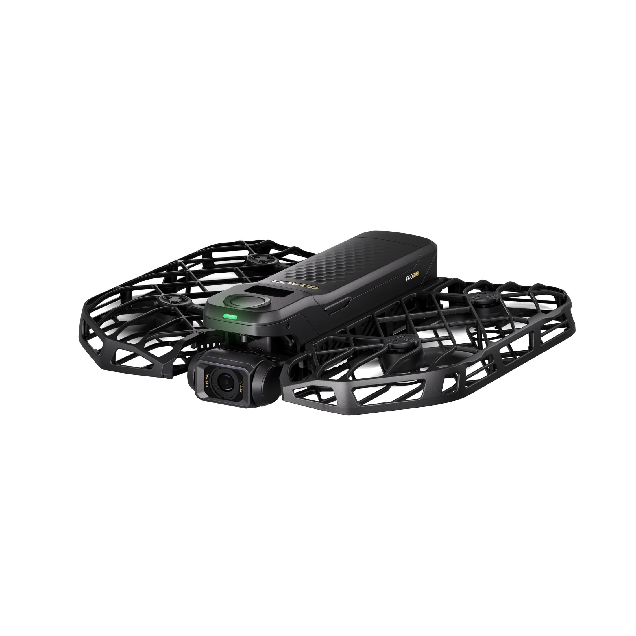 Czarny mini dron z osłoną kamery i osłonami śmigieł. Ma zielone światło.