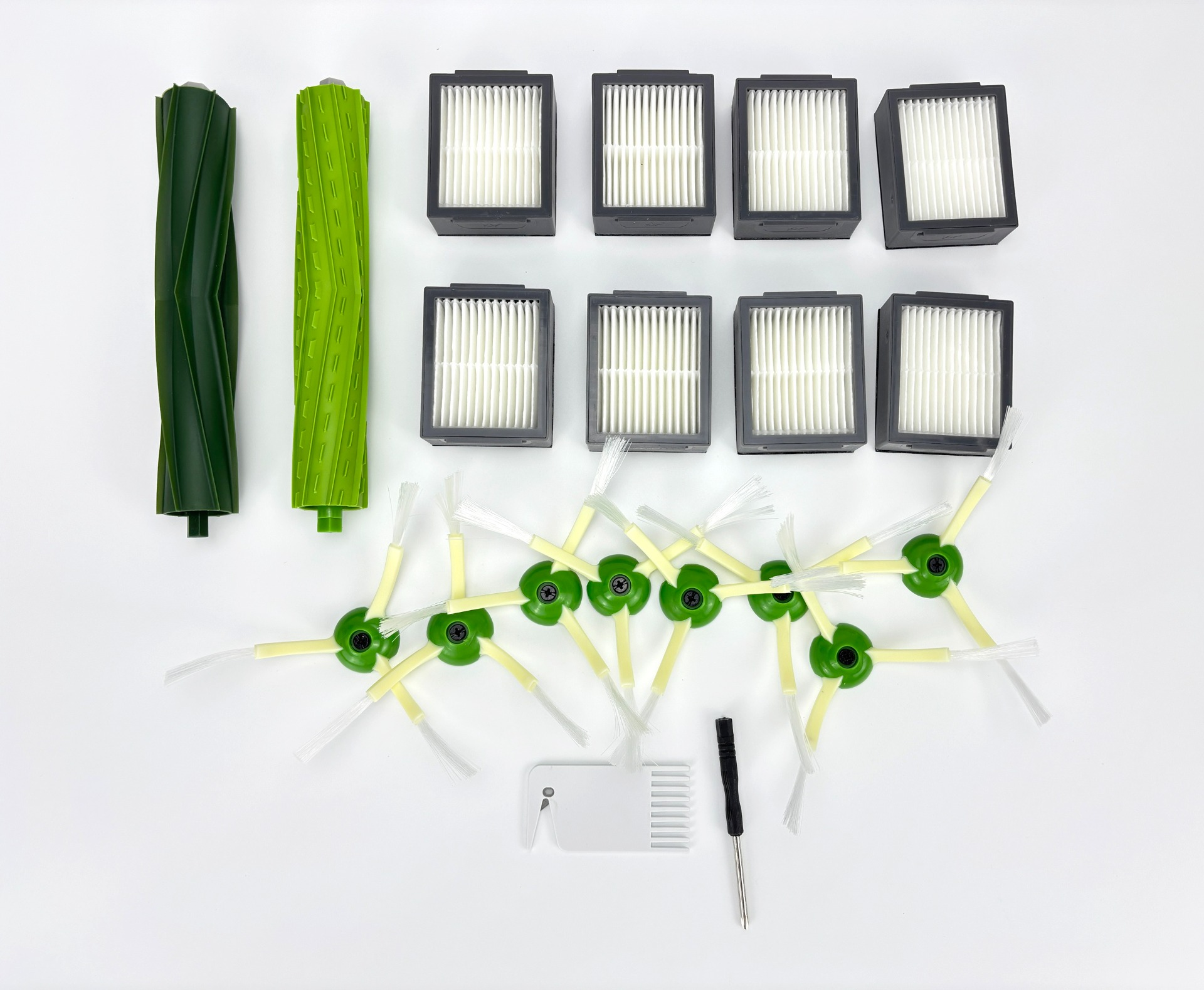 Dwa zielone wałki szczotek, sześć filtrów, cztery szczotki boczne, grzebień i śrubokręt.
